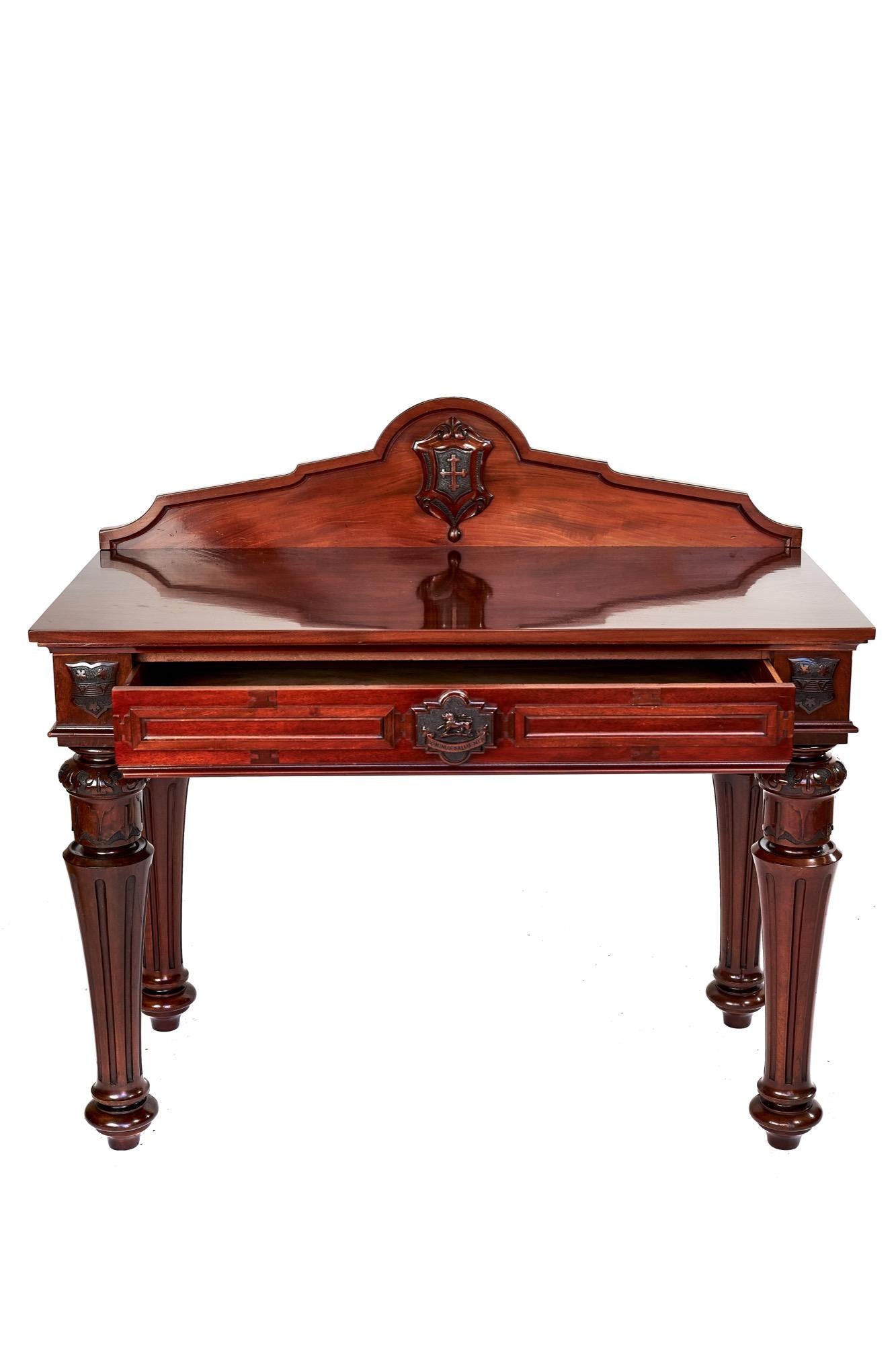 Fine rare 19th century Victorian mahogany hall/serving table having rare carved Armorial shields with carved cross to the back upstand, single centre drawer with an outstanding centre shield expertly carved with a lion and the Latin ‘Dominus Salus