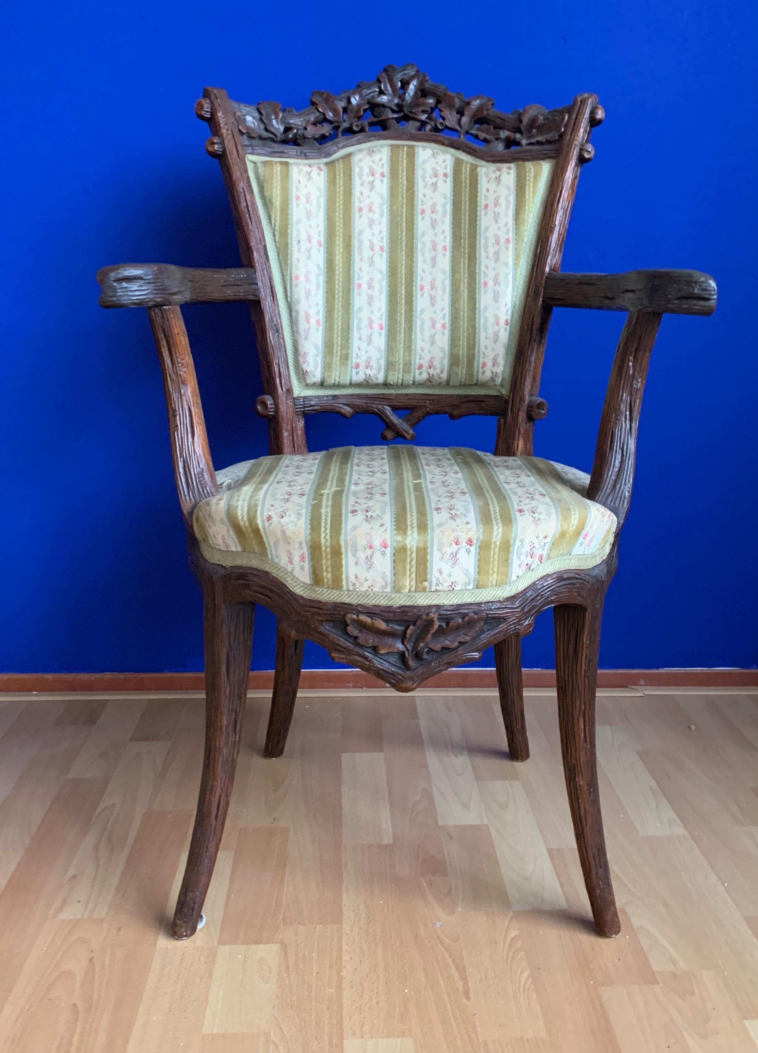 Unique, impressively carved and very comfortable chair from circa 1870. 

This unique chair is as strong and stable as the day it was made and the woodwork is in good to excellent condition also. The solid handcrafted nutwood frame comes with a