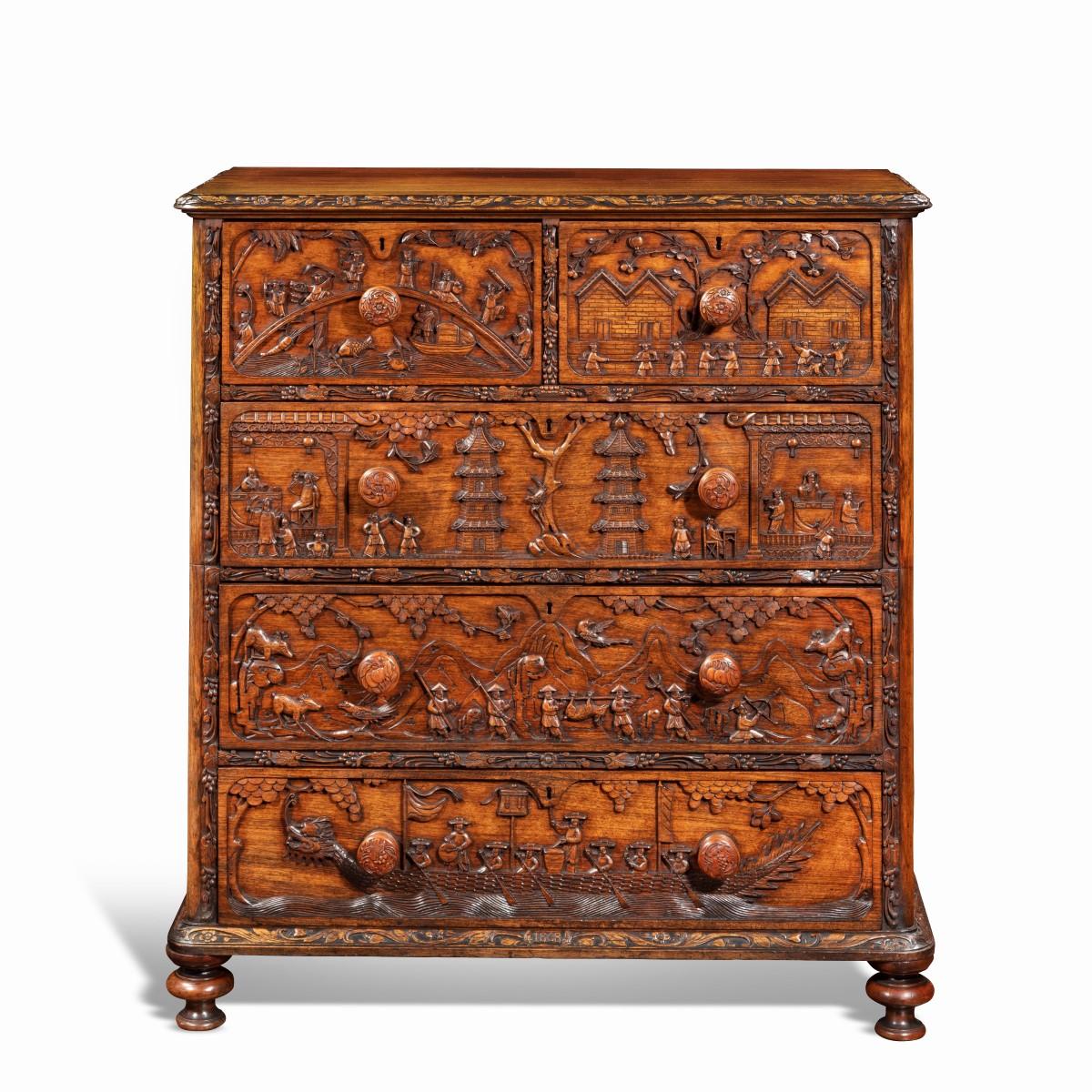 An ornate and unusual Anglo Chinese padouk campaign chest of drawers featuring the Eight Immortals, dated 1869 of rectangular form, in two sections, each with recessed carrying handles, the top section with two short and one long drawer carved in