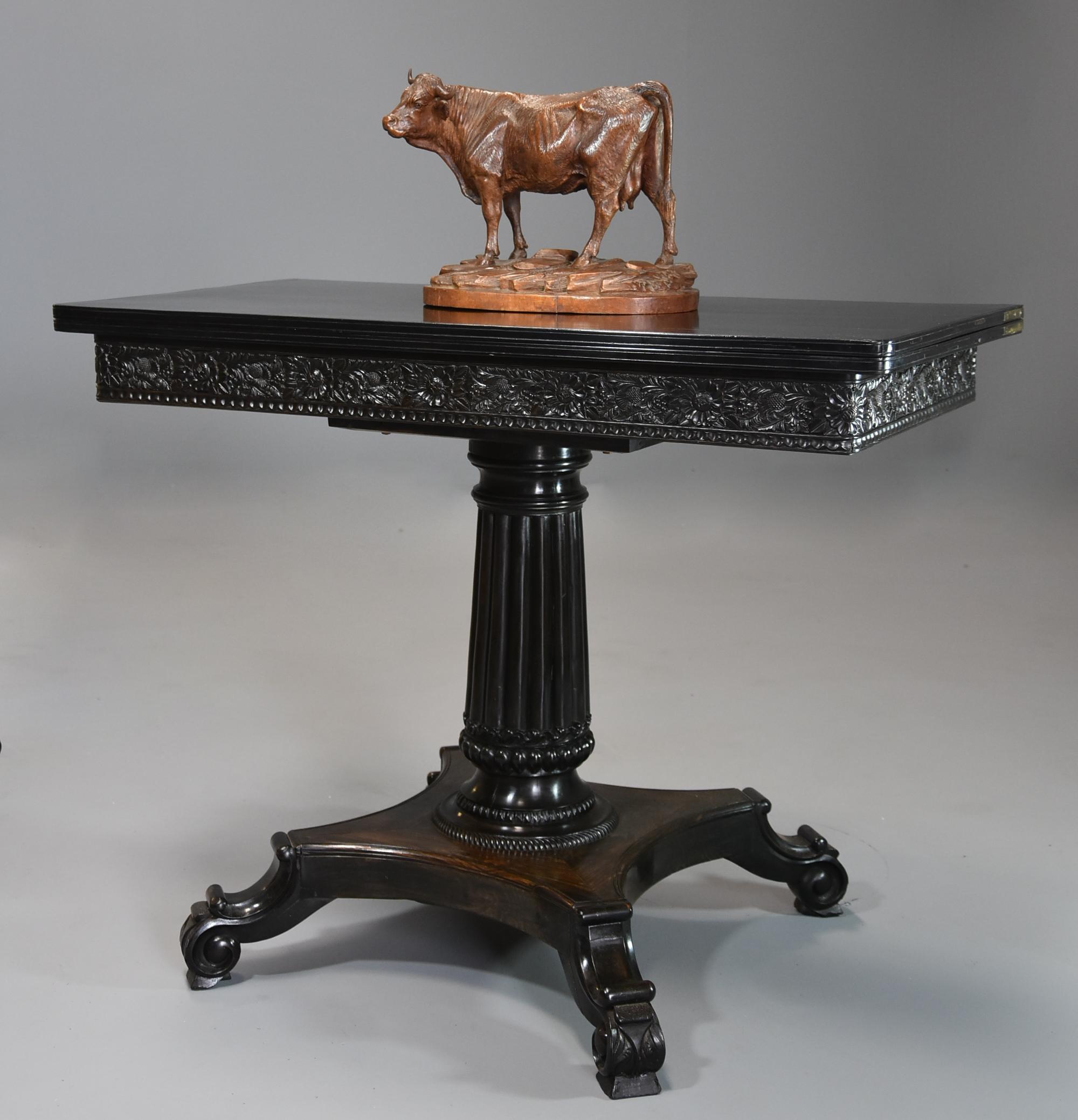 A rare early to mid-19th century (circa 1830) Ceylonese solid ebony card or games table from the Galle district (formerly Ceylon, now Sri Lanka).

This wonderful table consists of a solid ebony top with a moulded edge, the top opening to reveal a