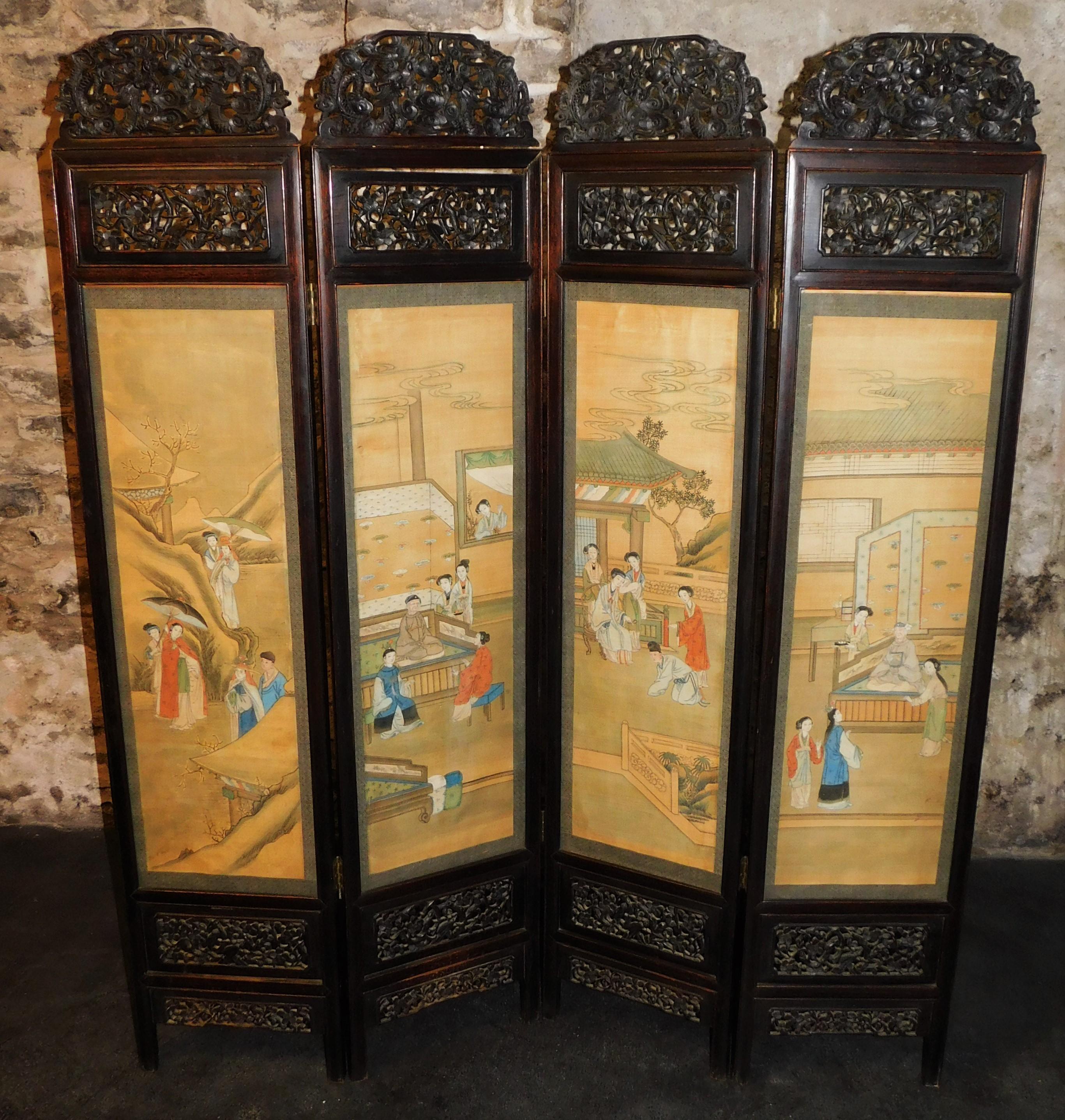 Ebonized wood four panel Chinese screen, circa 1850. Allegorical story depicting the dream of the red chamber beautifully presented on this rare four-panel silk room divider screen. Intriguingly carved top and bottom sections of each screen.
Each