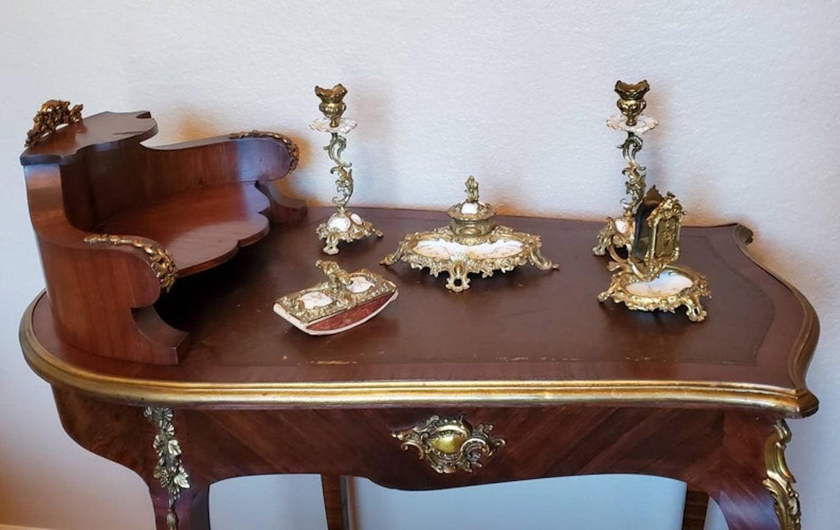 A very fine quality, exquisitely hand-crafted, late nineteenth century bronze doré mounted Royal Porcelain Factory Berlin (KPM) porcelain five piece desk set. 

The breathtaking antique set features Hermann August Seger porcelain, ornate highly