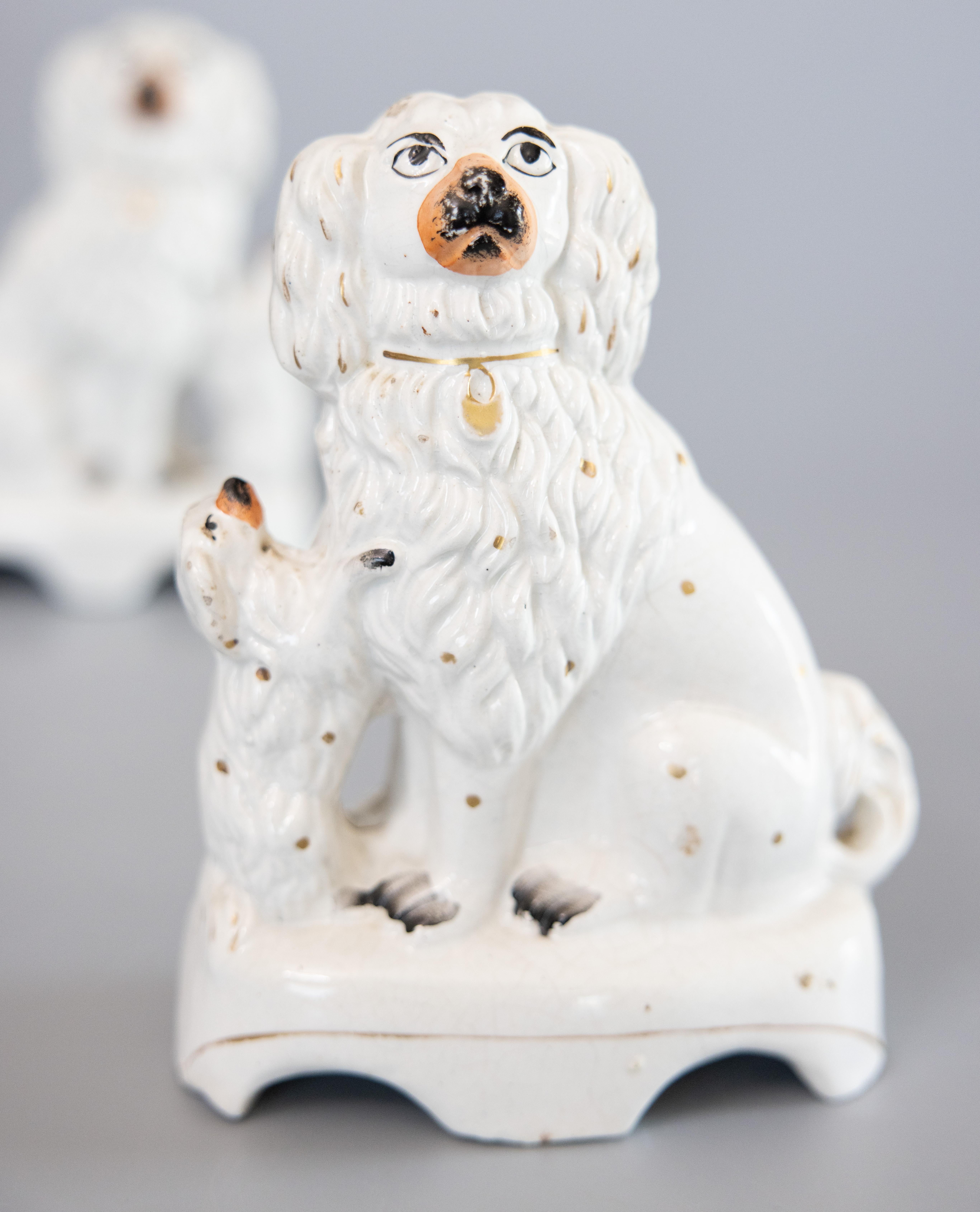 Victorian Rare Pair of 19th Century English Staffordshire White Spaniel Dogs With Pups For Sale