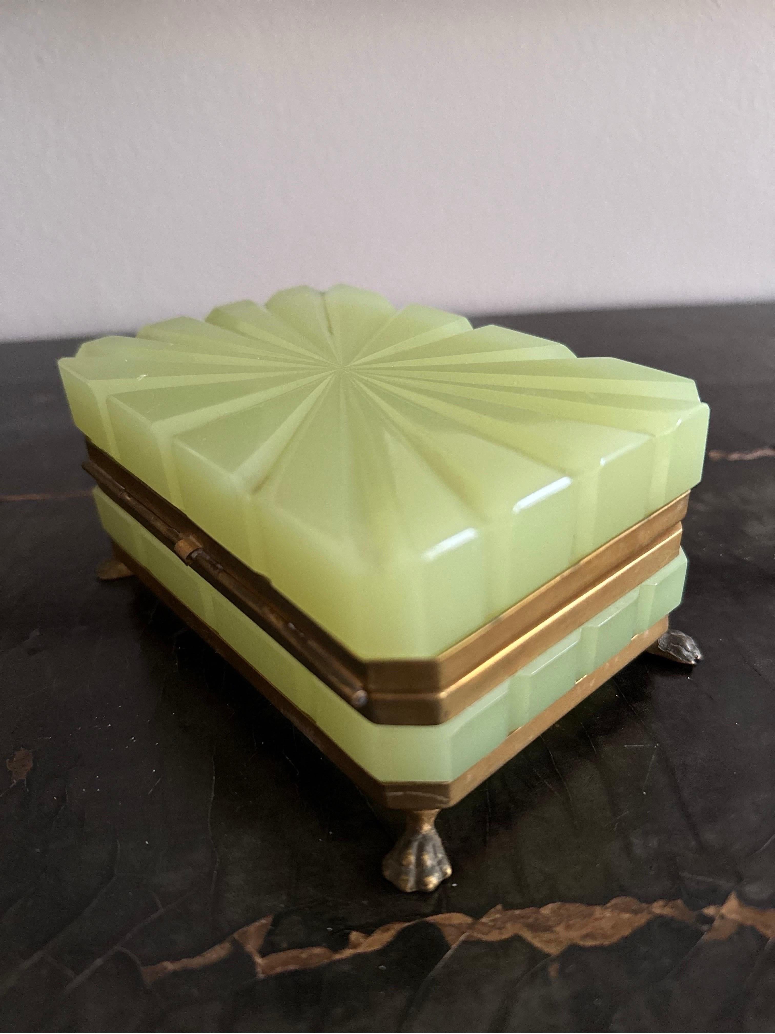 Step into the enchanting past with our rare find – a 19th Century French Opaline Glass Trinket Box, a true testament to refined elegance. This jewel, weighing 981 g., captivates in a unique pistachio green hue, a rare delight in this intricately