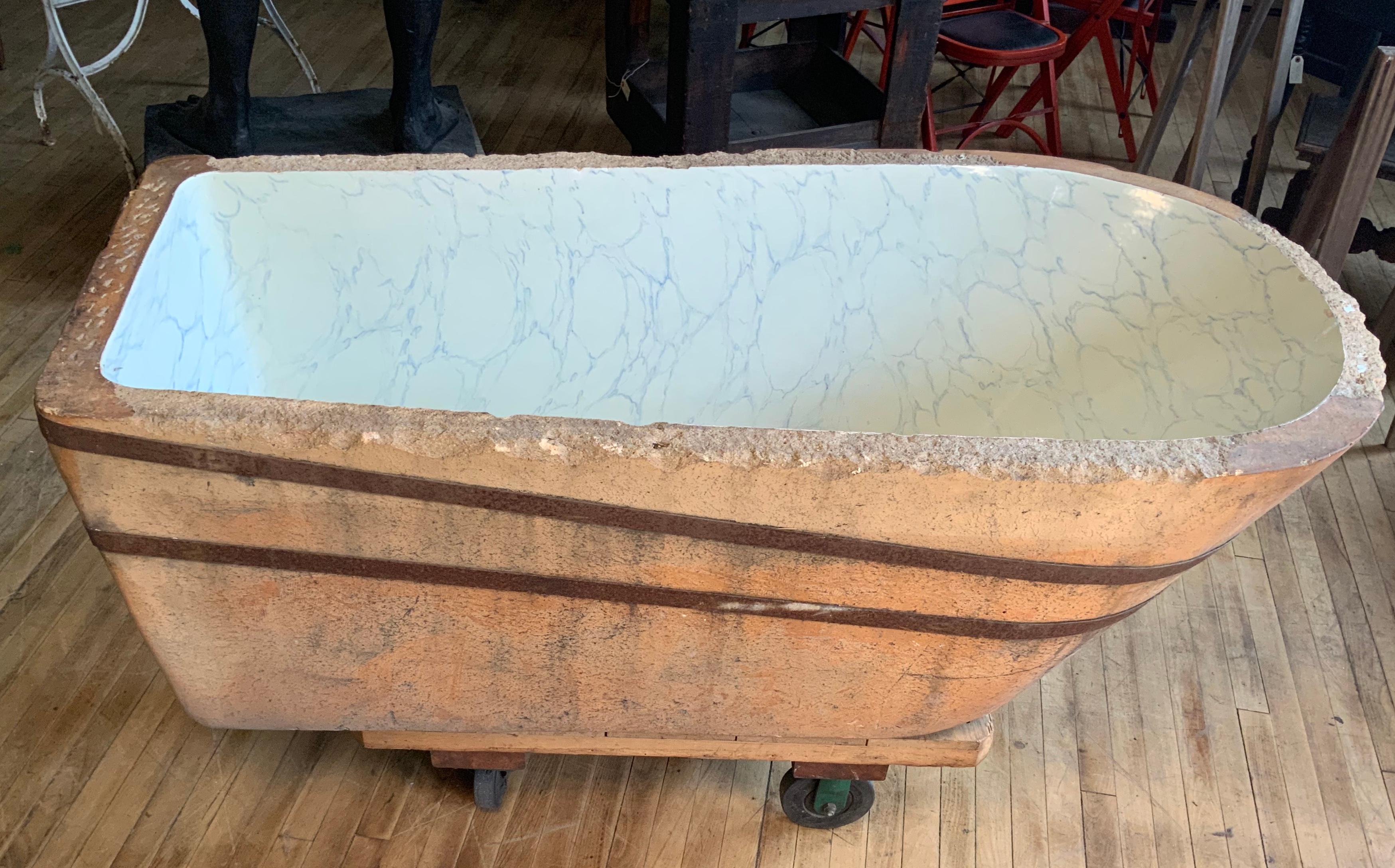 A rare 19th century glazed ceramic bathtub, with a marbleized interior. Wonderful scale and form.