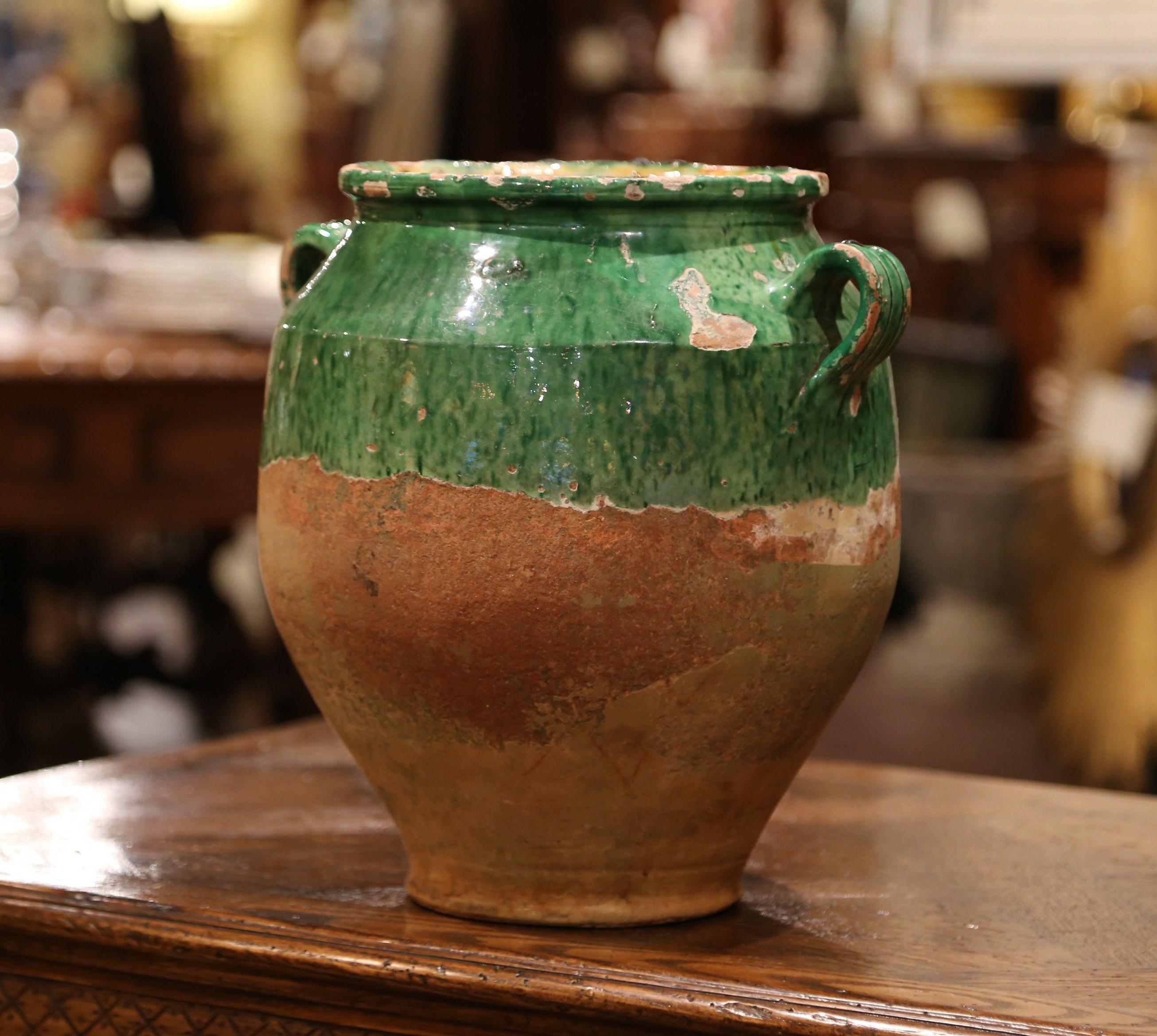 Hard to find with green glazing, this large colorful French confit pot with a glaze upper portion was created in the Perigord region of France, circa 1870. Made of earthenware, these traditional vessels were once used daily in the French country