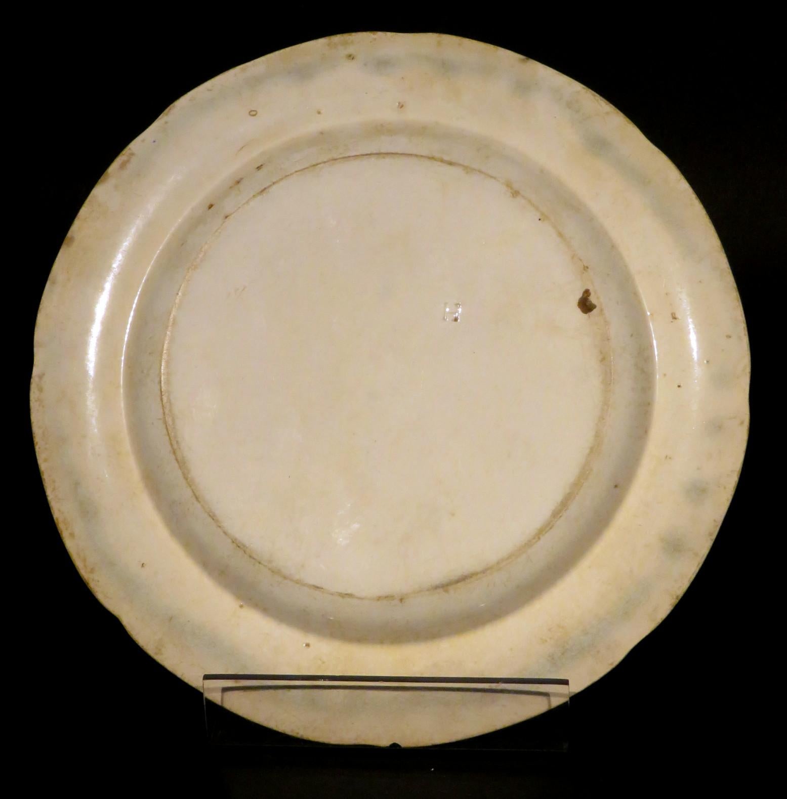 This rare Herculaneum factory cabinet plate showing classical theme transfer decoration against a terracotta vermiculé ground, the underside bearing the impressed letter H denoting Herculaneum Potteries, Liverpool. 
Herculaneum Potteries produced