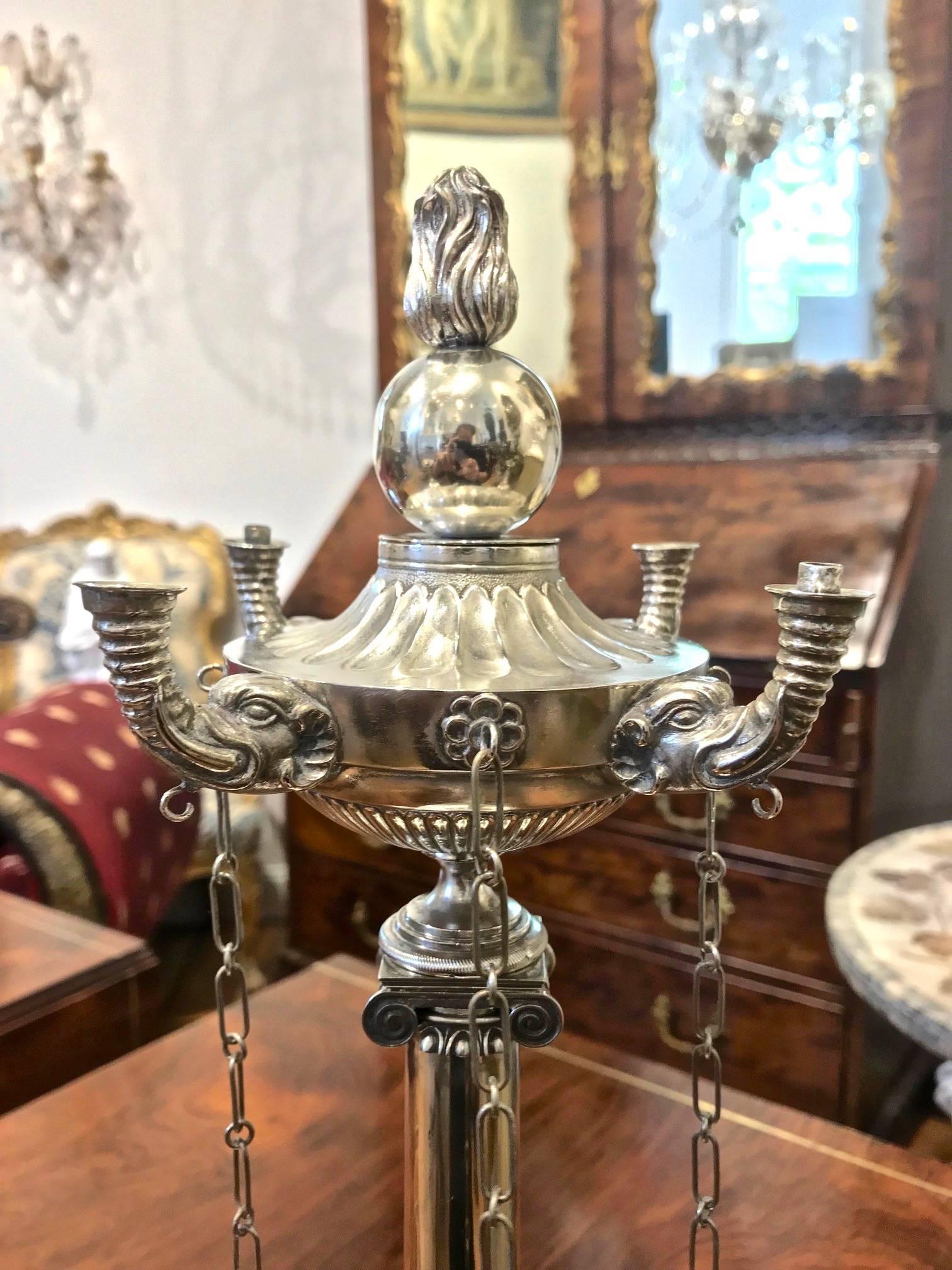 Period Indian silver oil lamp of neoclassical inspiration

--Early 19th century
--Original Throughout including wick tools and flame/ball finial
----heavily inspired by the Roman and Lucerne silver oil lamps of the late 18th and early