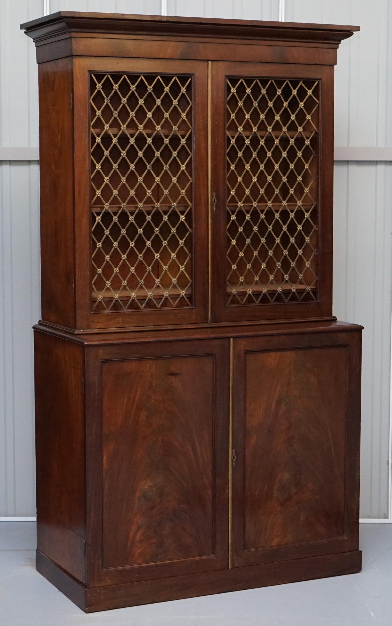 We are delighted to offer for sale this absolutely stunning Victorian mahogany with bronzed gold gilding pierced metal work doors and fittings bookcase sitting on a large chest of drawers inside the cupboard

A very good looking and large