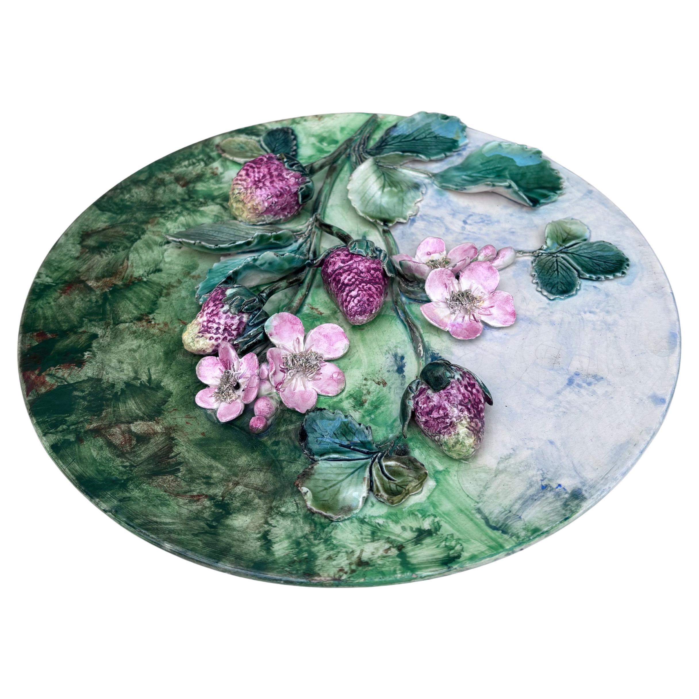 Very Rare Colorful 19th Century French Majolica strawberries wall platter signed Longchamp terre de fer. The fruits are in high relief with the leaves and branches.
11.5 inches diameter.
The manufacture of Longchamp produced this fruits platters