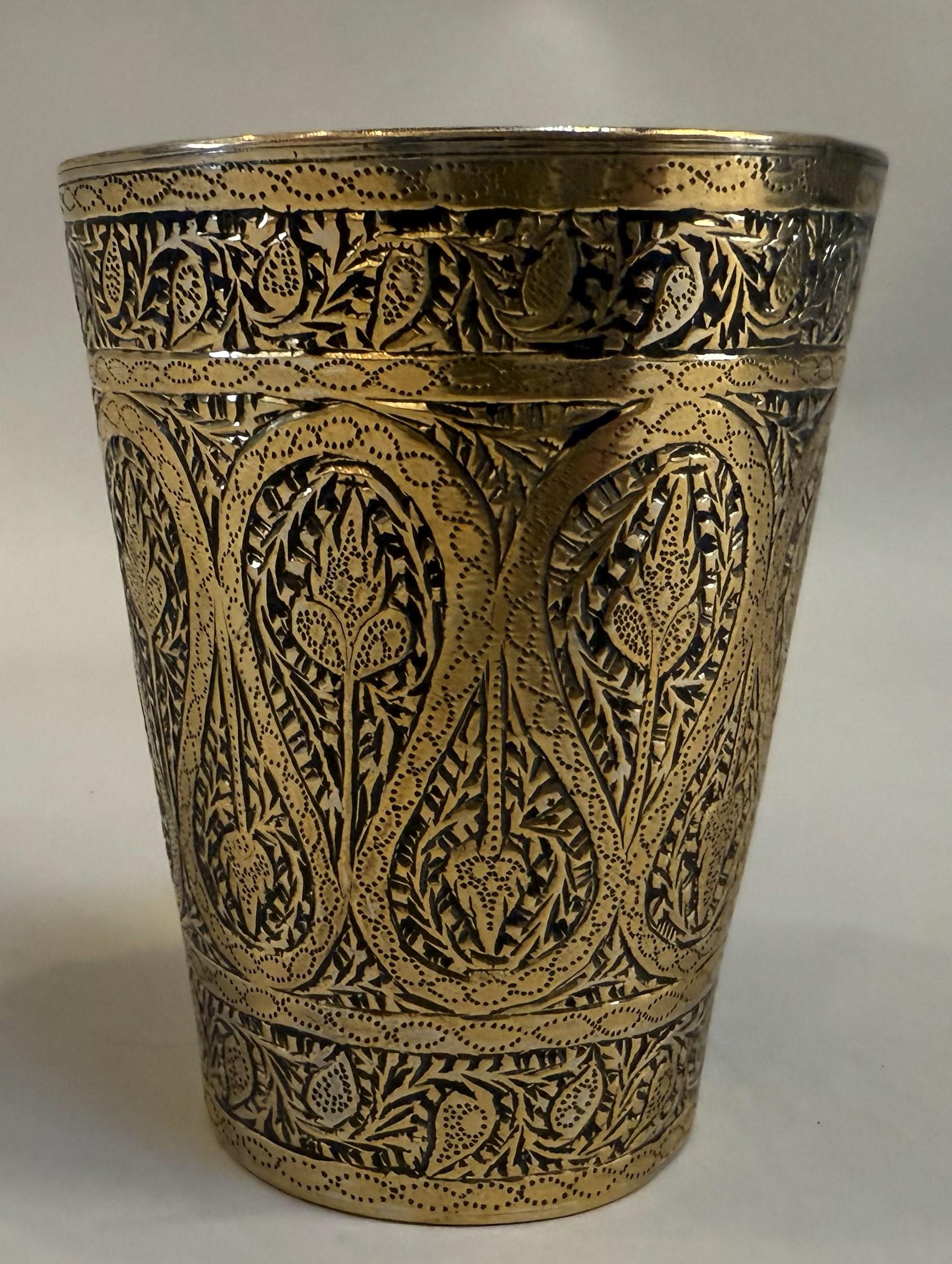 Rare 19th Century Persian Brass Cup with extraordinary geometric incised floral decoration. Substantial with beautiful patination. Made circa 1820.

A finely crafted Persian brass cup dating to the early 19th century, circa 1820. This elegant vessel