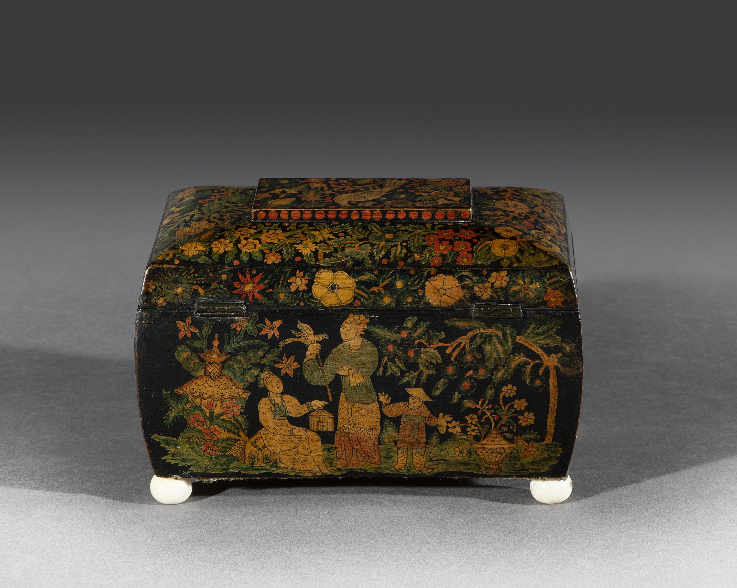 The tea caddy top is profusely decorated with exotic flowers and foliage and centred with a bird perched on a branch. The lid opens to reveal two compartments with the original coloured lids which retain the original colours of 'the day'. The tea