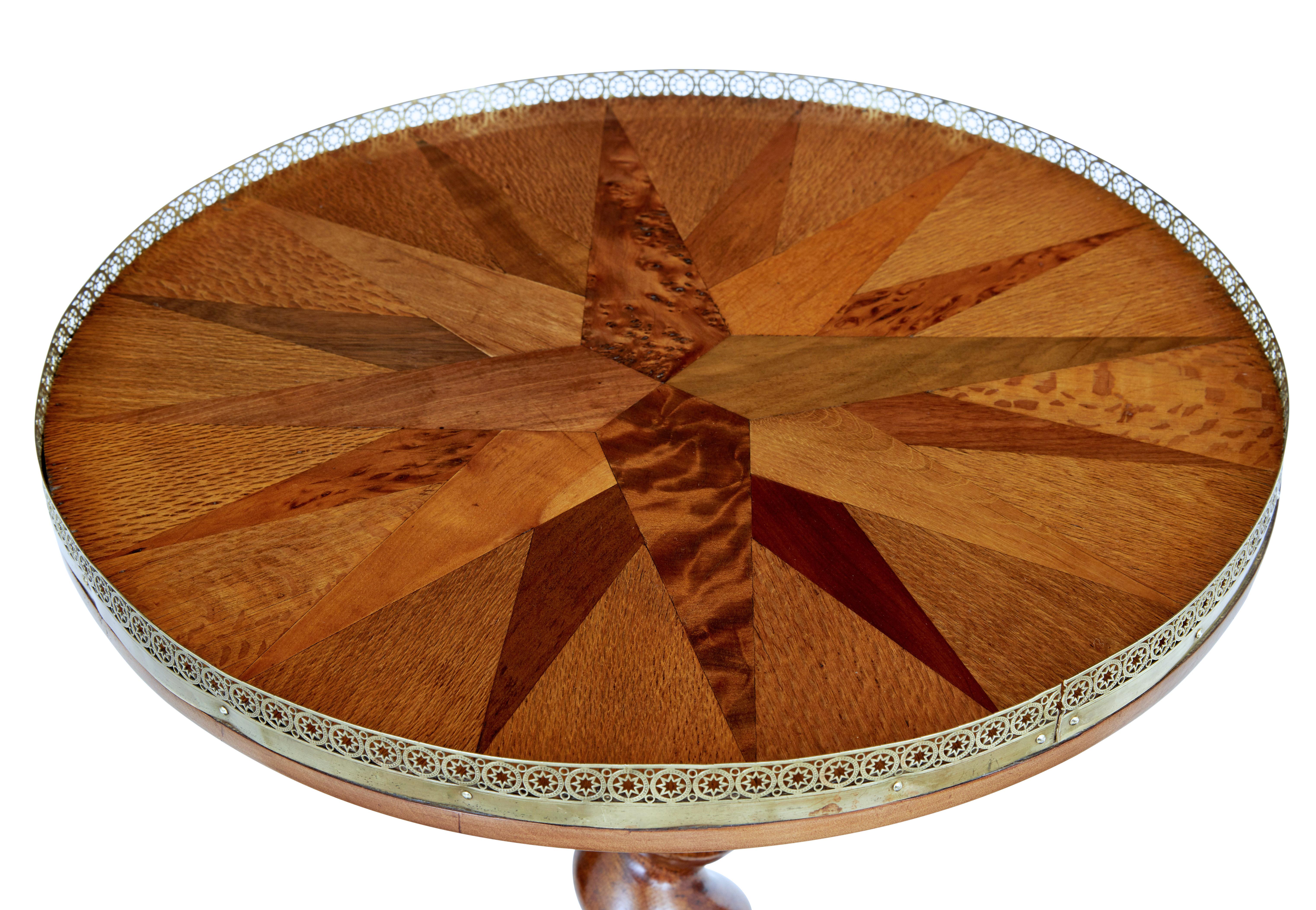 Rare 19th century occasional table, circa 1870.

Round top with has been beautifully arranged into segments showcasing various rare woods, which have been labelled underneath the top. Pierced brass gallery applied around the top edge.

Standing