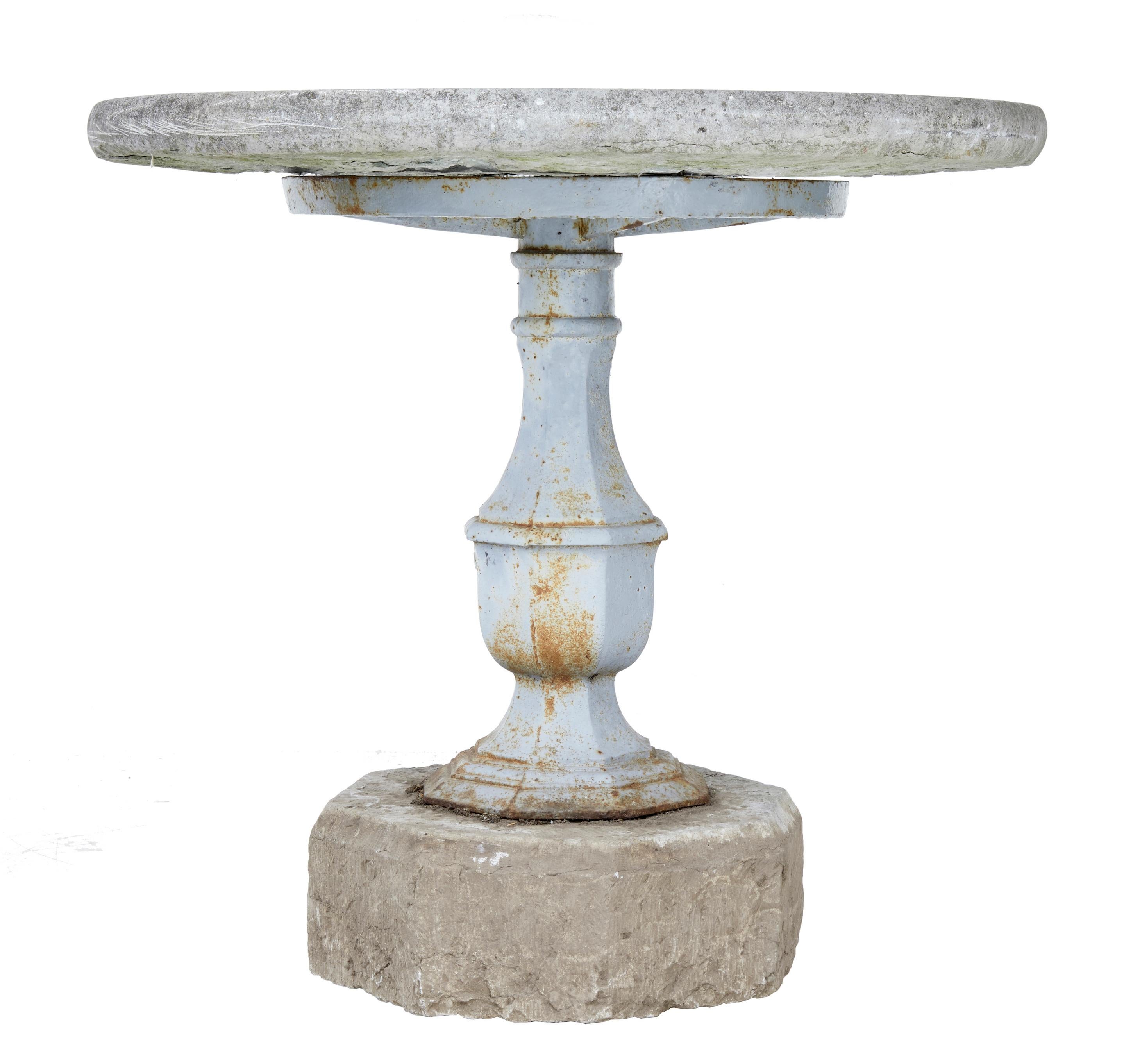 Rare 19th century Swedish stone and iron garden table circa 1860.

The manufacture of cannons at the Stavsjo Bruk is well known and that is where the base of this table was made. Taxinge castle is a stately home west of Stockholm. Round 2 1/4