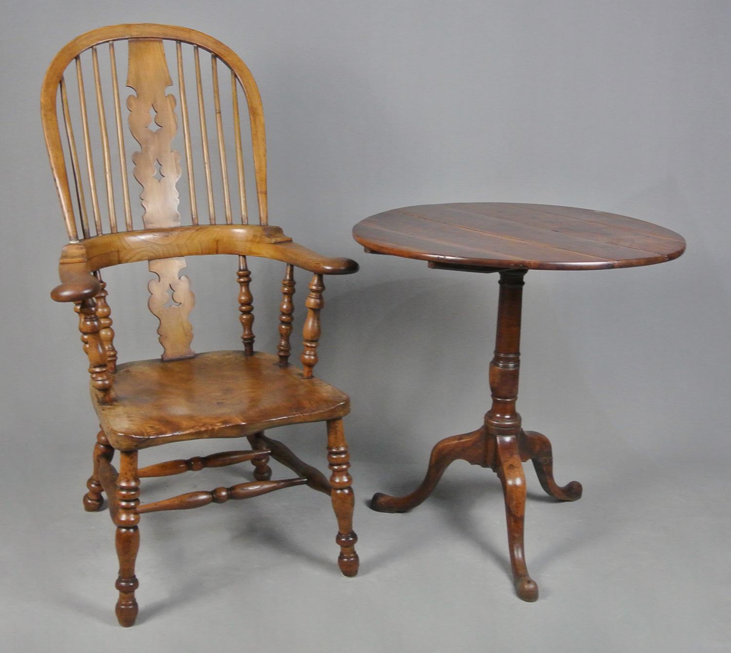 A most attractive and unusual Windsor chair made of yew wood, elm and ash and with wonderful colour and in superb original condition.  

Traditionally the saddle seats were made in elm because elm trees grow to such a size and girth that a wide and