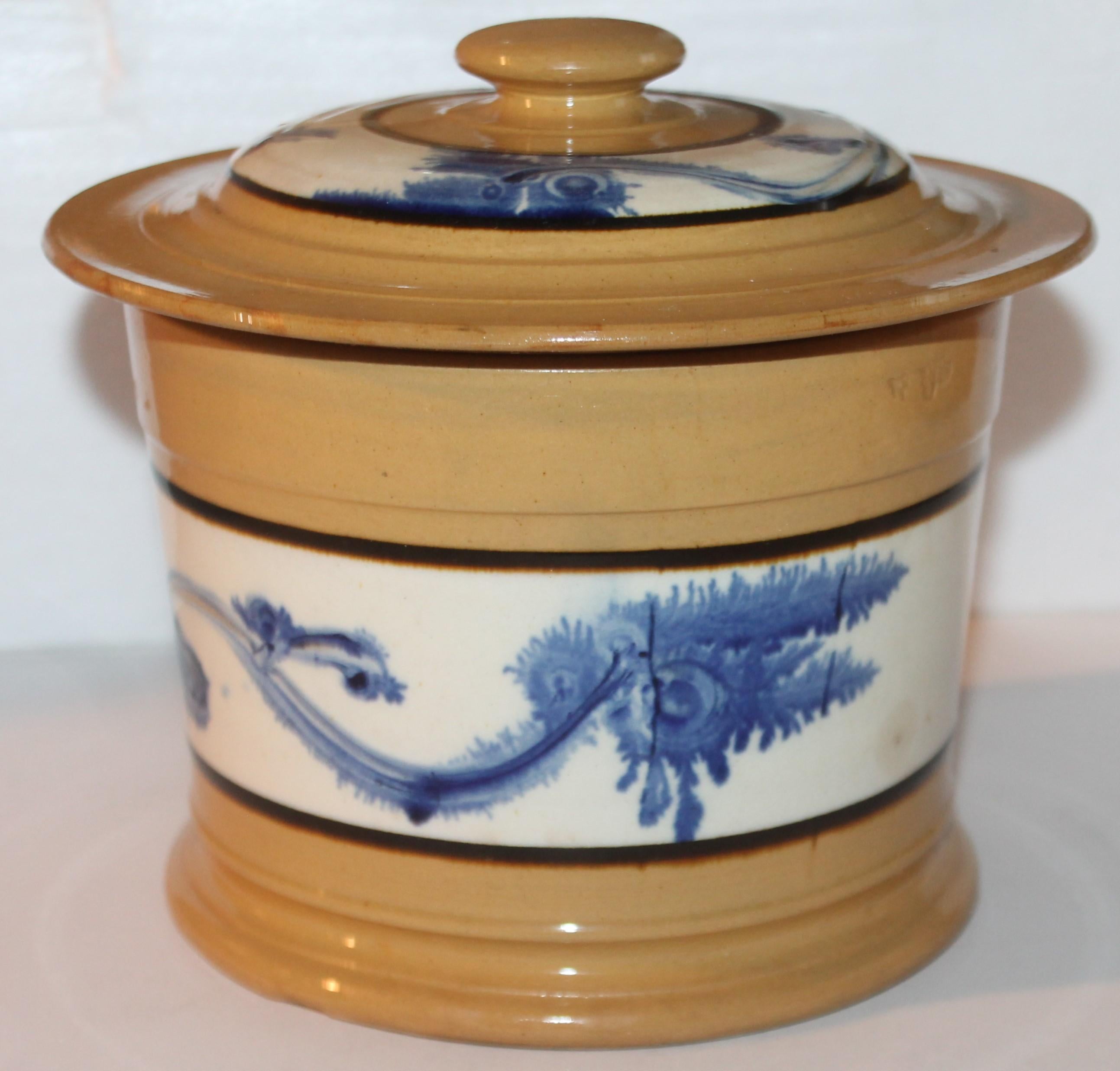 This fine mocha seaweed yellow ware butter tub is in fine condition and has the original lid.