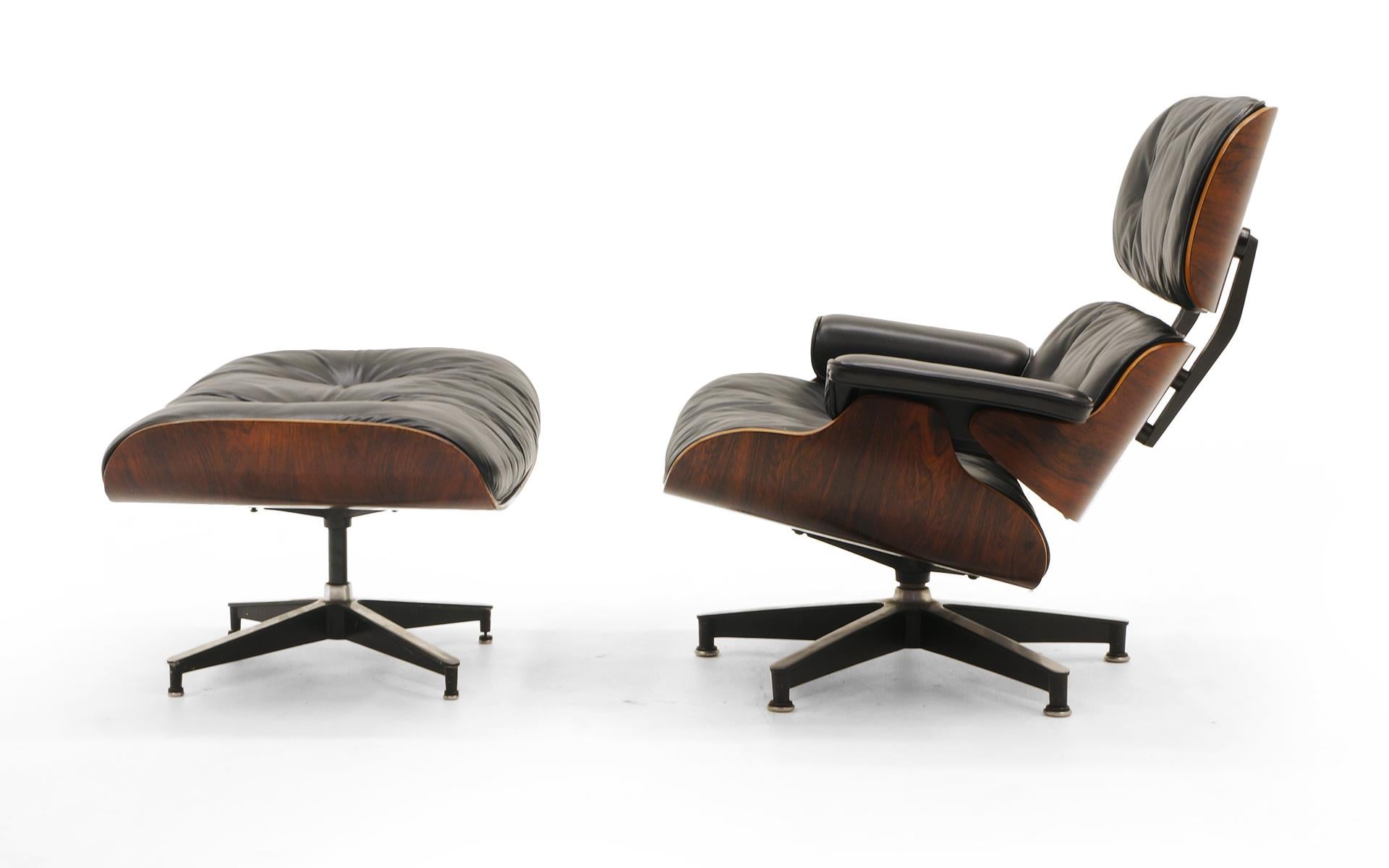 Ultra rare first series production Charles and Ray Eames lounge chair model 670 and ottoman model 671 for Herman Miller in Brazilian Rosewood with the original black leather cushions which have been professionally restored, not replaced. We know