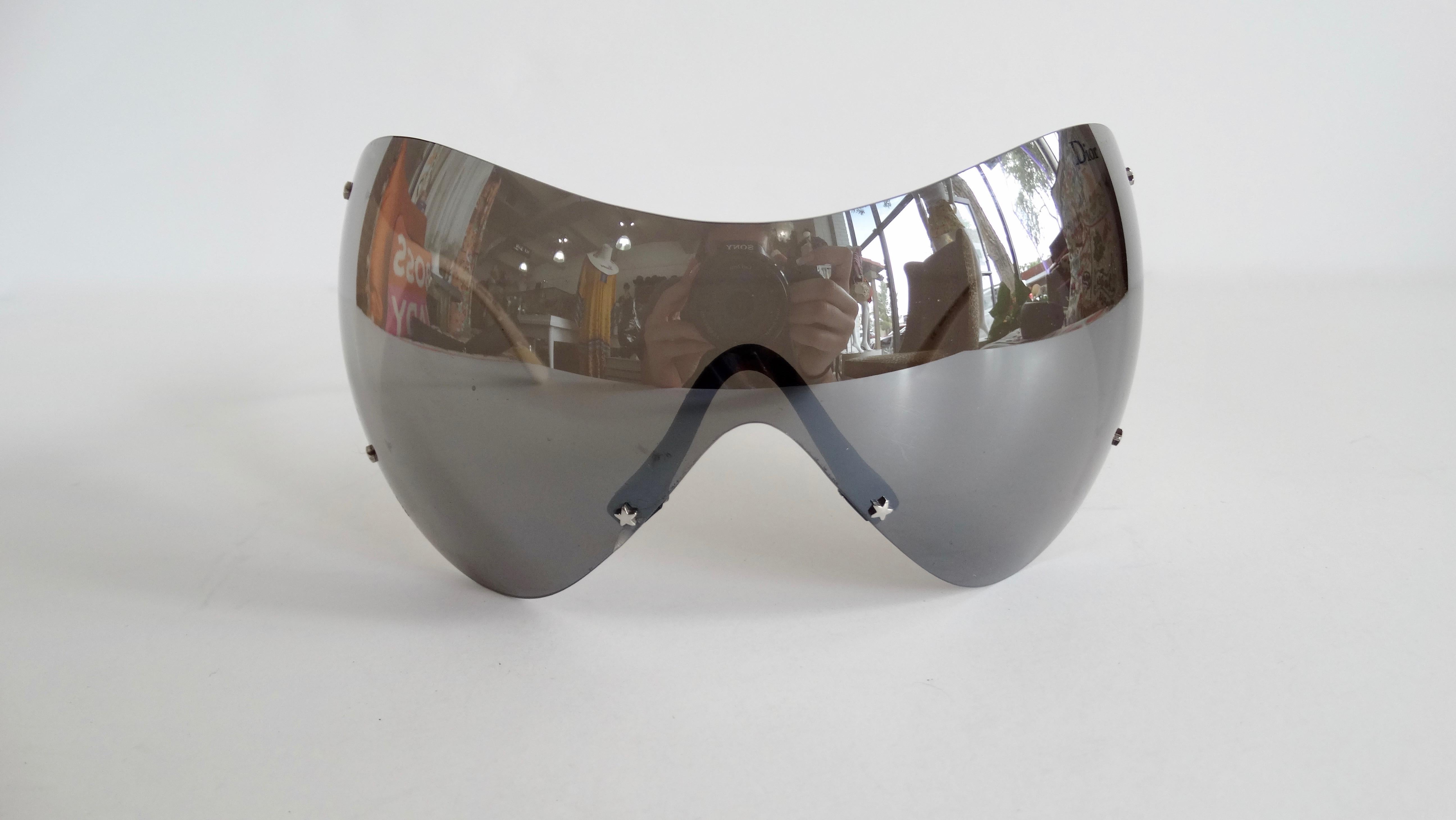 Snag yourself a piece from the Galliano for Dior vintage archives with these amazing sunglasses! Circa early 2000s, these ski sport sunglasses feature large reflective grey lenses and thick white arms that include Dior in contrasting black letters.