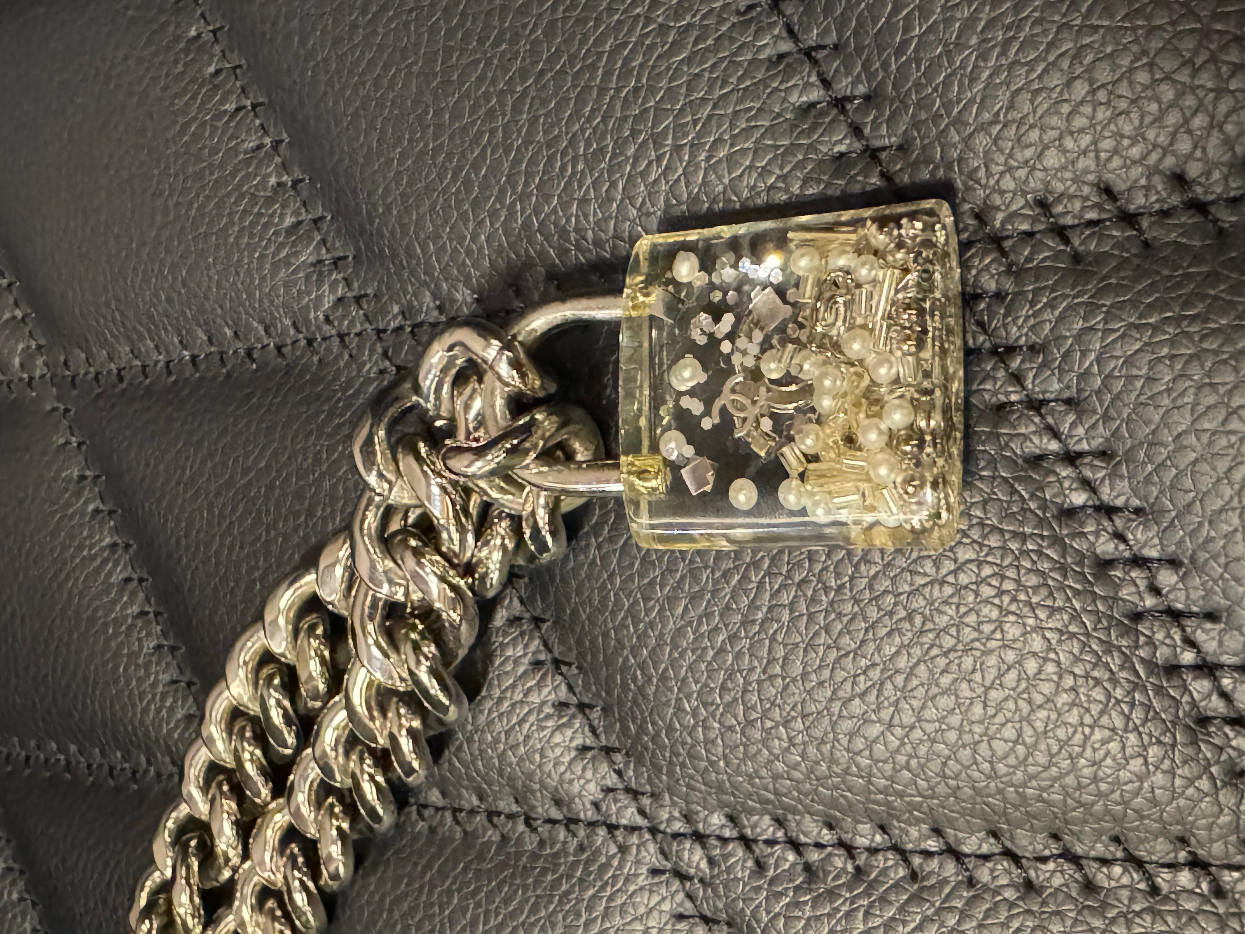Rare Chanel resin padlock with silver chunky chain design. Very cute statement piece. In very good condition. Comes as is with replacement dust bag. Adjustable length.