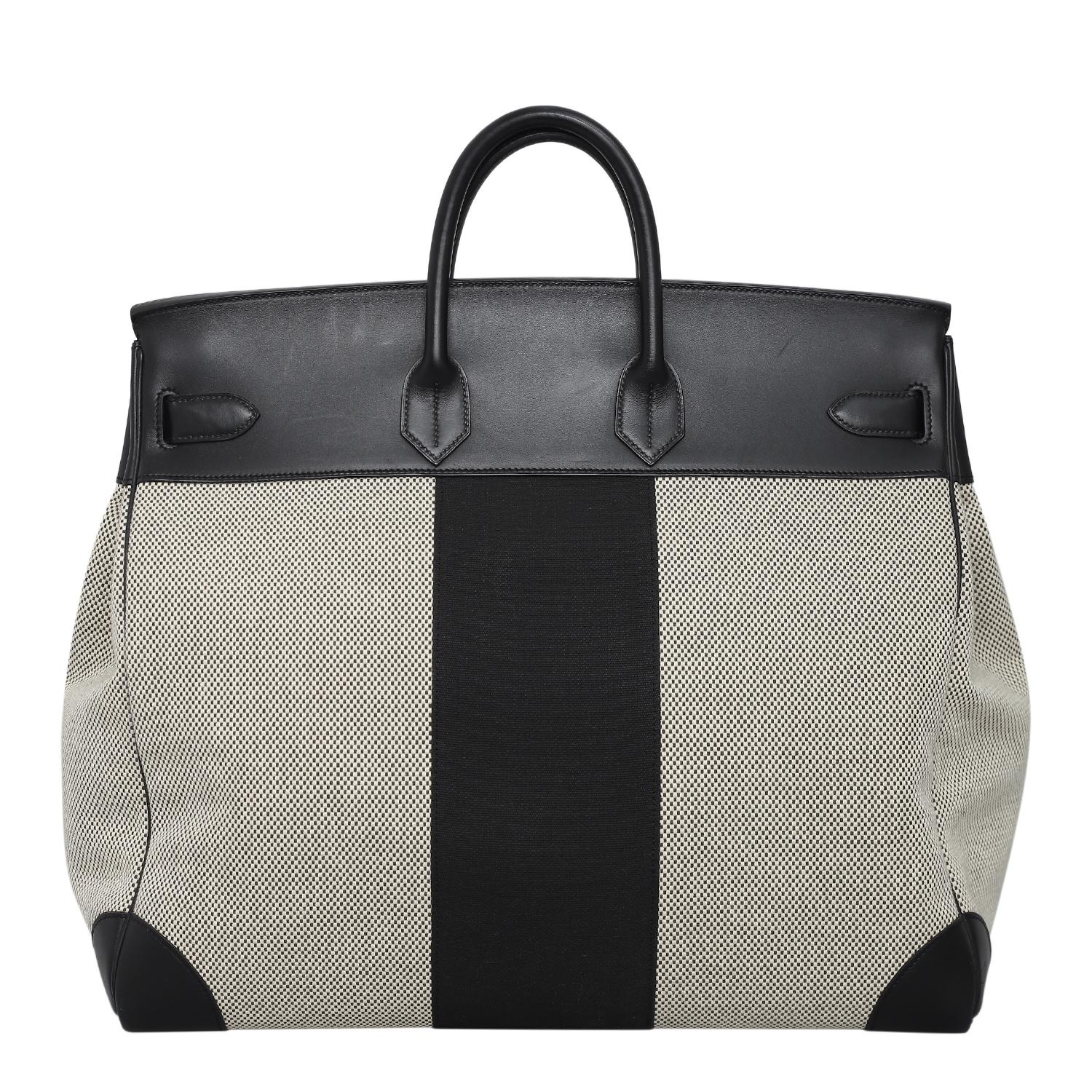 Rare birkin 50 hac toile flag in black evercalf with palladium hardware. Stamp T (2015). Comes with its tools and dust bag. In very good condition, minor scratches on the leather area.