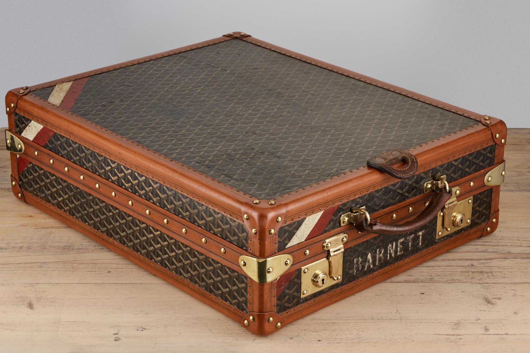 Rare 20th century vintage Goyard trunk circa 1920 fitted as a shoe box with a leather flap on the leading edge suitable for hanging while this piece is used.
The canvas exterior is in excellent condition with all the Goyard markings the brass