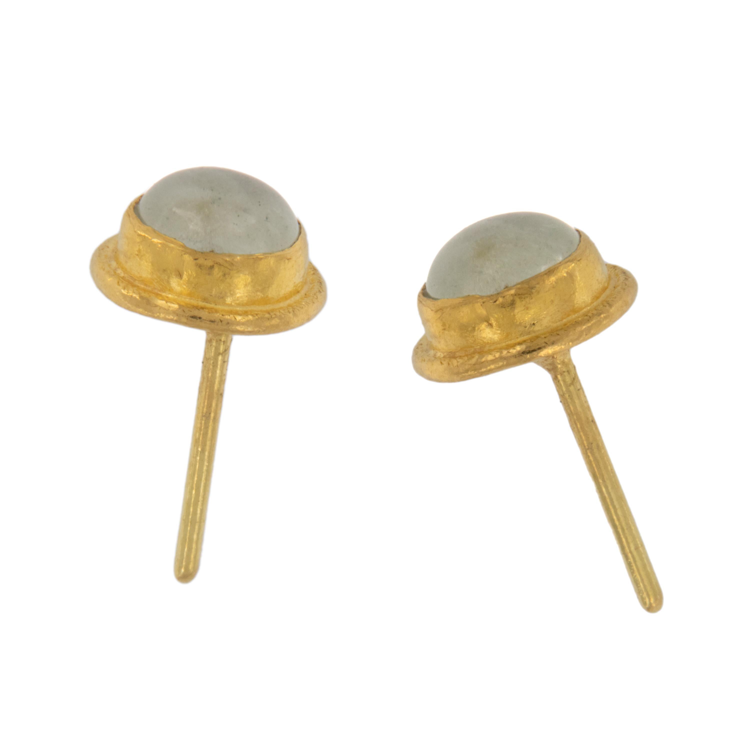 Rarest of all the golds & prized for its rich, warm color these 24 karat yellow gold stud earrings feature 2  round cabochon cut Aquamarine's = 1.36 Cttw. While being the birthstone for March, legends also say that Aquamarine originated in the