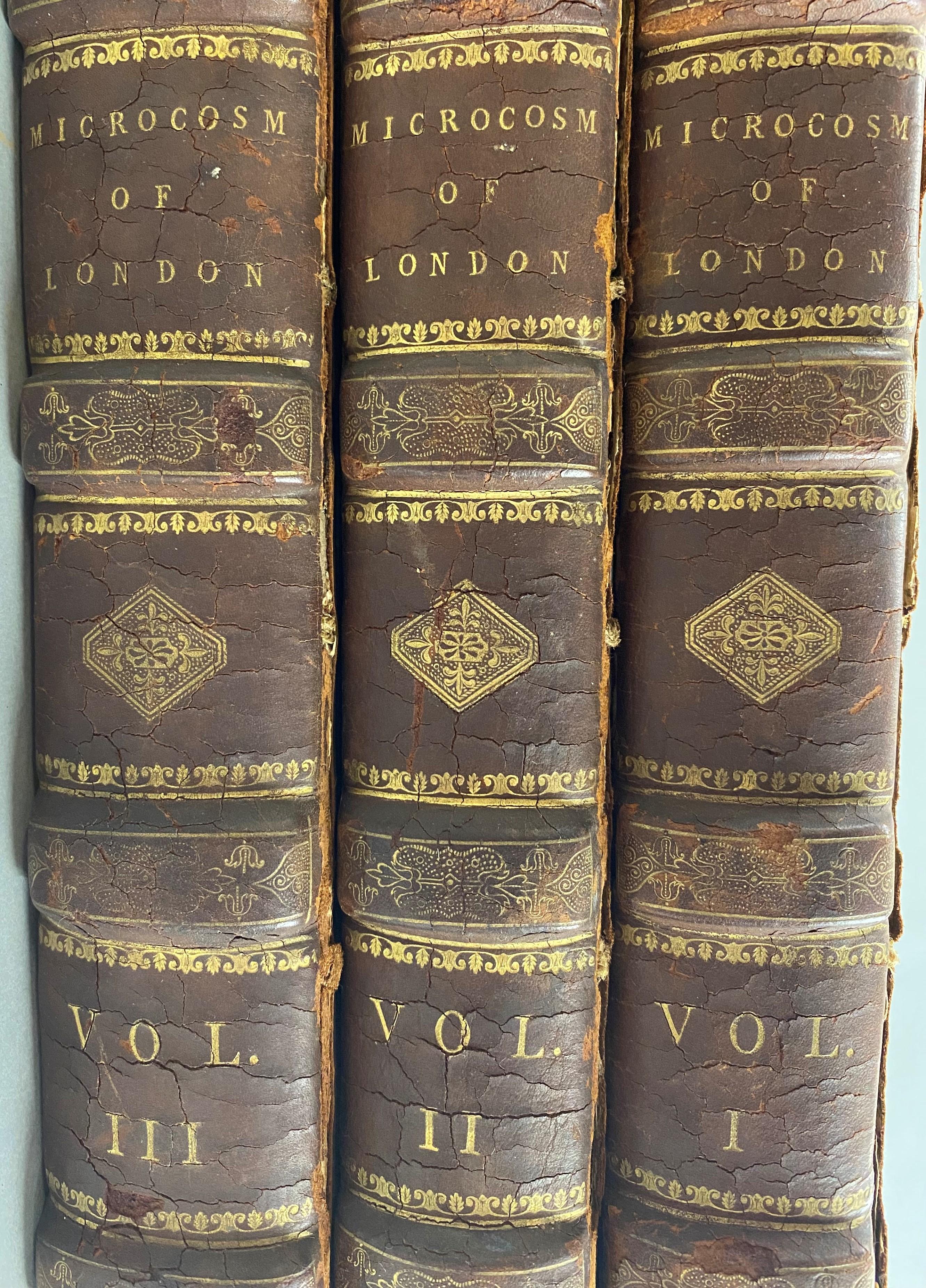 A rare leatherbound three volume book set titled “Microcosm of London or London in Miniature” published by Rudolph Ackerman (1764 - 1834), illustrated with 104 aquatint plates after Thomas Rowlandson & Augustus Charles Pugin (each plate dated 1808