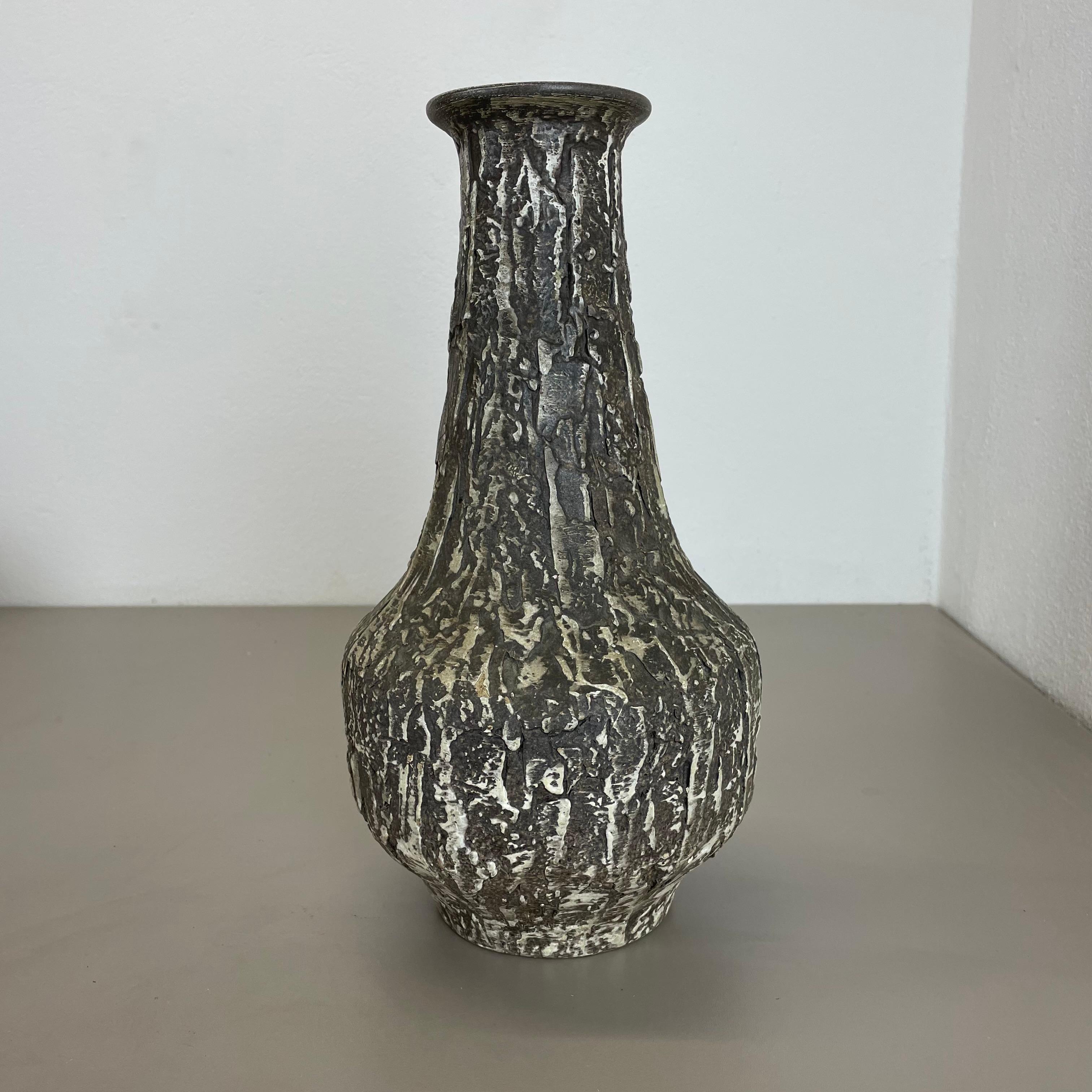 Article:

Pottery ceramic vase 


Producer:

ILKRA Ceramics, Germany


Decade:

1970s





Original vintage 1970s pottery ceramic vase made in Germany. High quality German production with a nice abstract brutalist surface glaze. The vase was