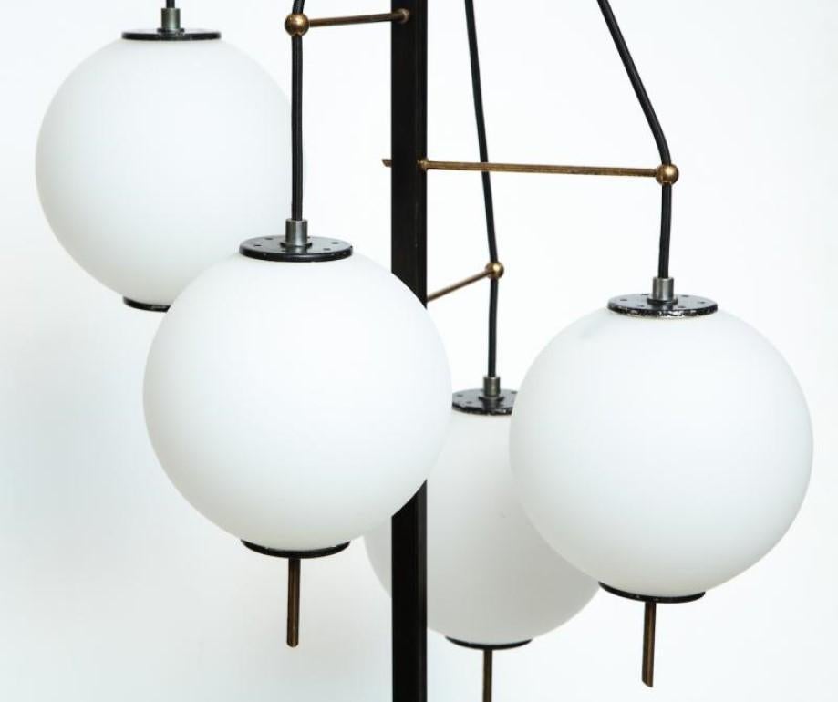 Rare 4-Light Floor Lamp by Stilnovo.  Unusual model with oxidized brass and black painted metal elements. 4 frosted glass globes set at alternating heights. Each globe conceals 1 standard sized Edison socket. White marble base.