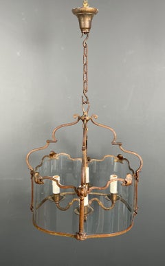 Rare 4 lights gilt beaten wrought iron lantern with curved glasses. French work.