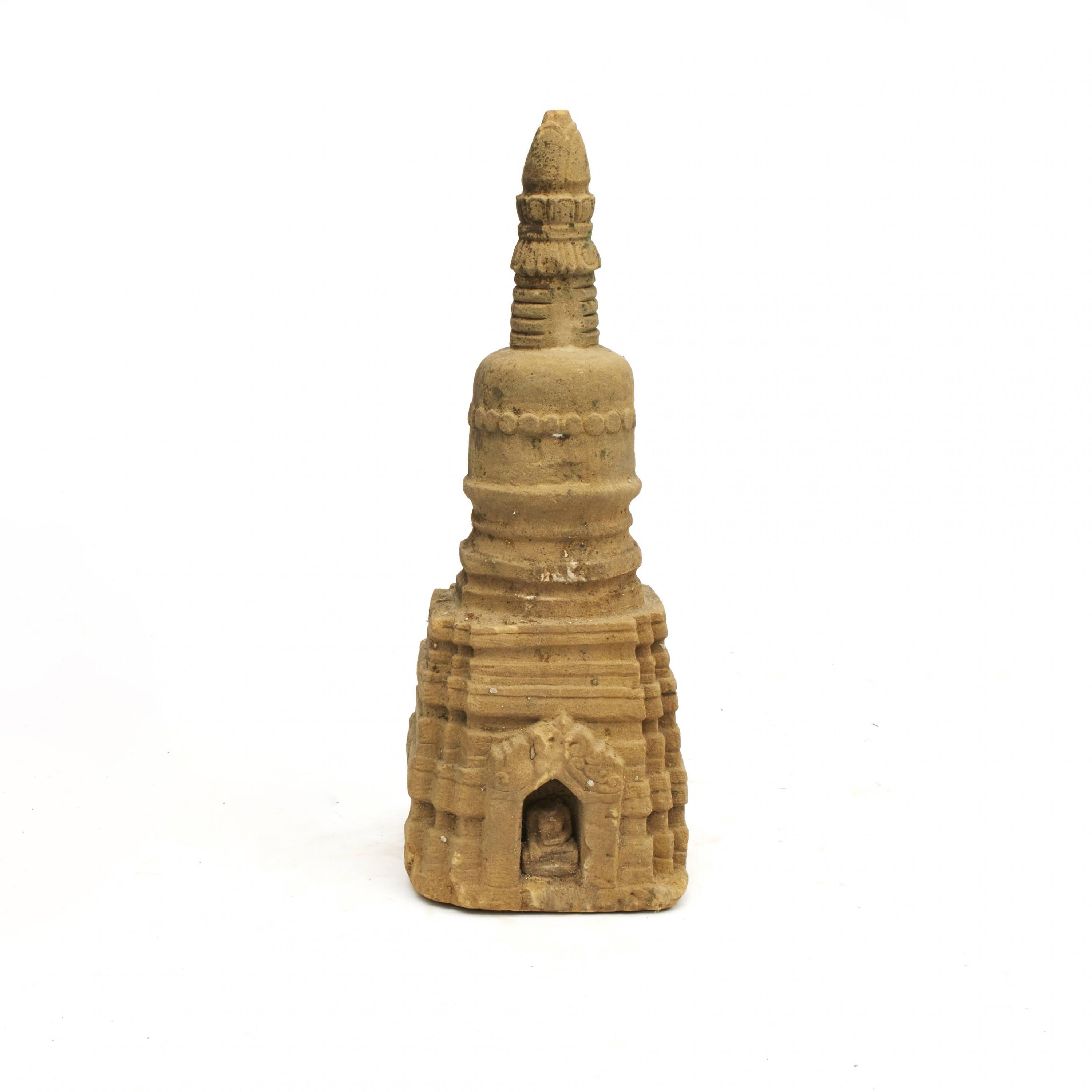 Rare stupa sculpture, 400-600 years old, carved in sandstone. In original untouched, well-preserved condition. From Arakan in Burma.
Typical stupa construction with square base, hemispherical dome and conical spire.
At the base a portal door with