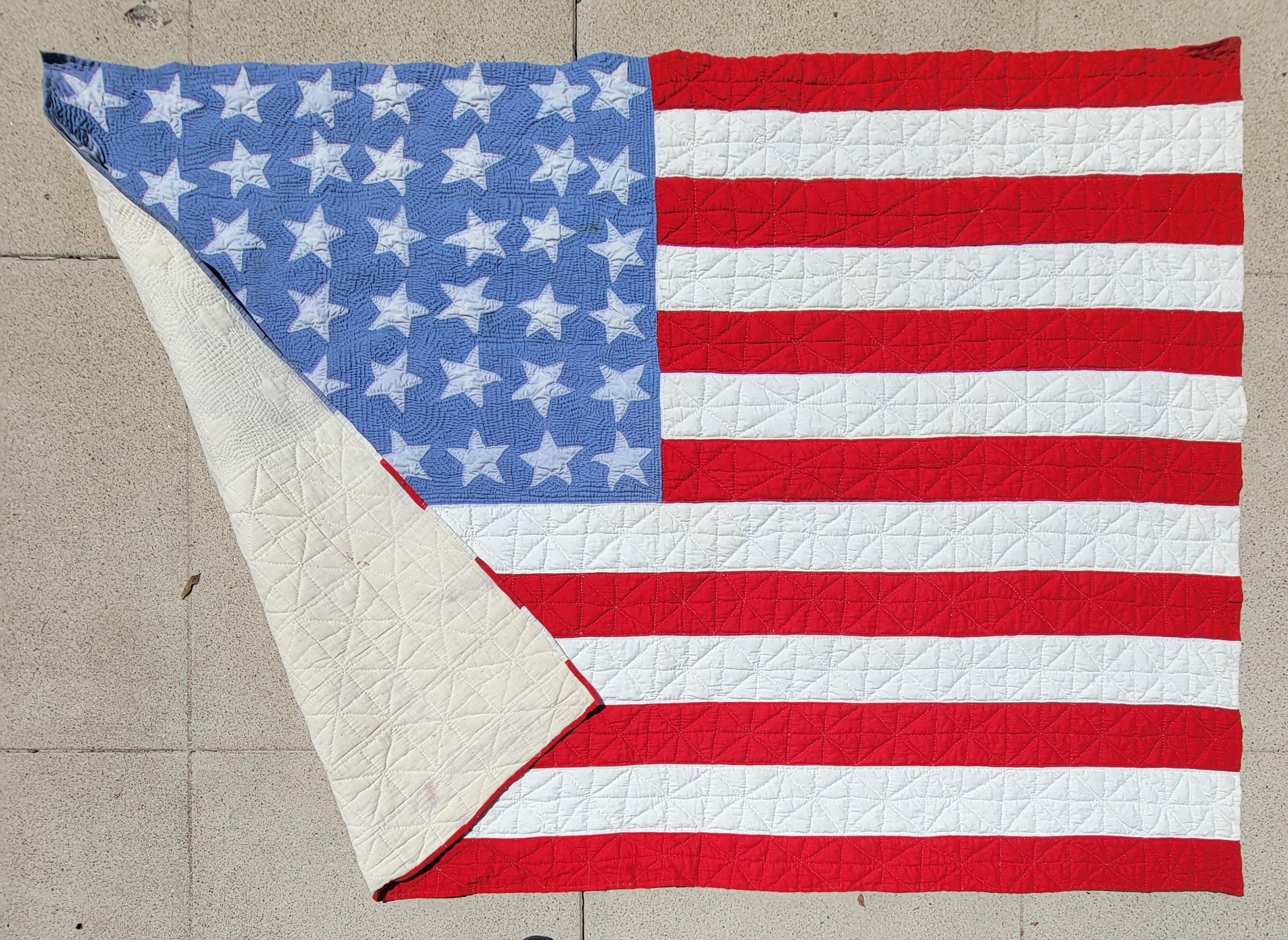 This is an amazing 48 hand sewn stars flag quilt has fine quilting and piece work comes from a private folk art collection.This is a great example of Americana.Great addition to any quilt or folk art collection.
