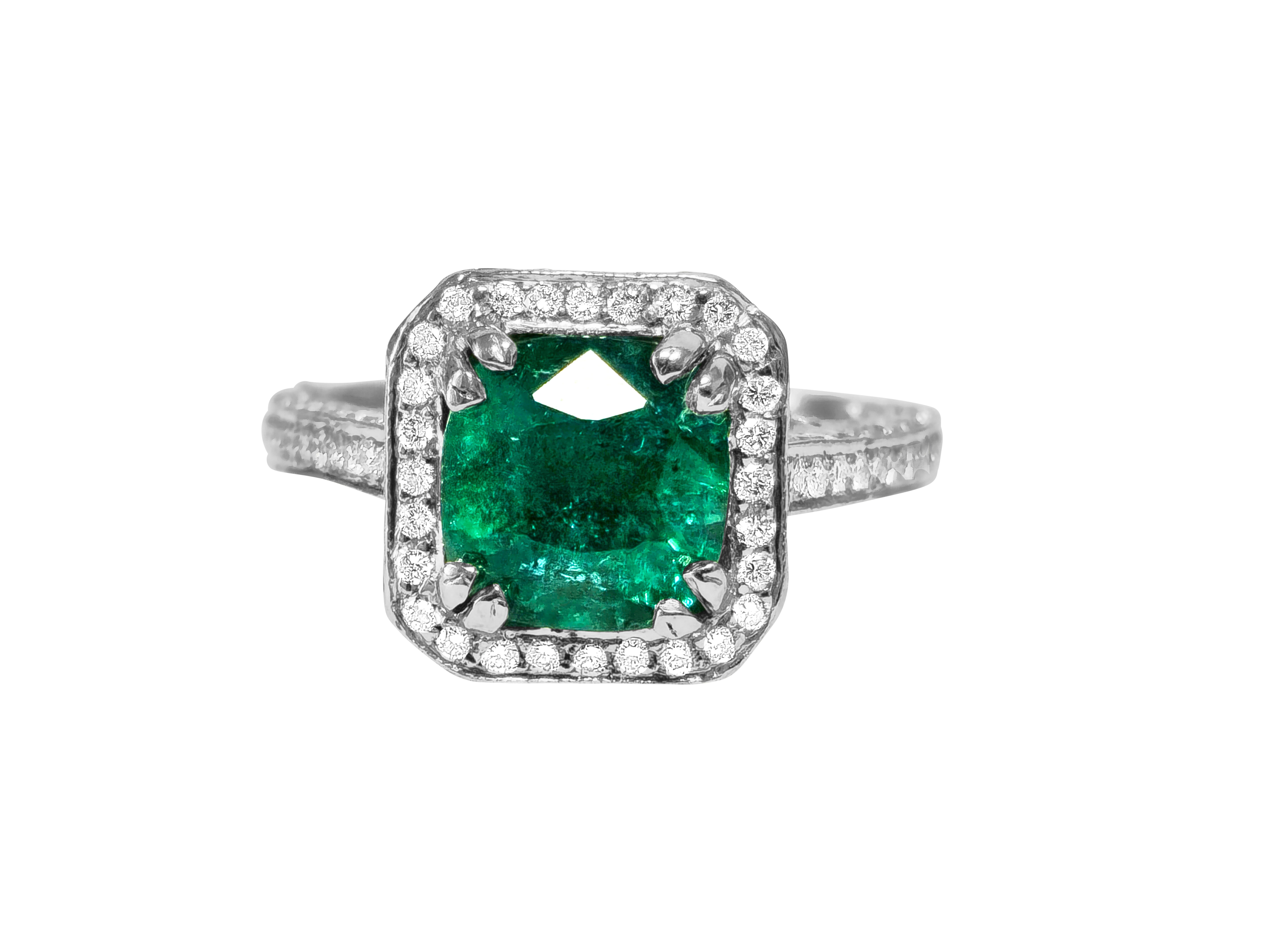 Forged in platinum, this captivating engagement ring boasts a majestic 4-carat cushion-cut emerald, exhibiting a mesmerizing deep saturation and stunning color. Accompanied by a total of 2.5 carats of diamonds, renowned for their VS clarity and F