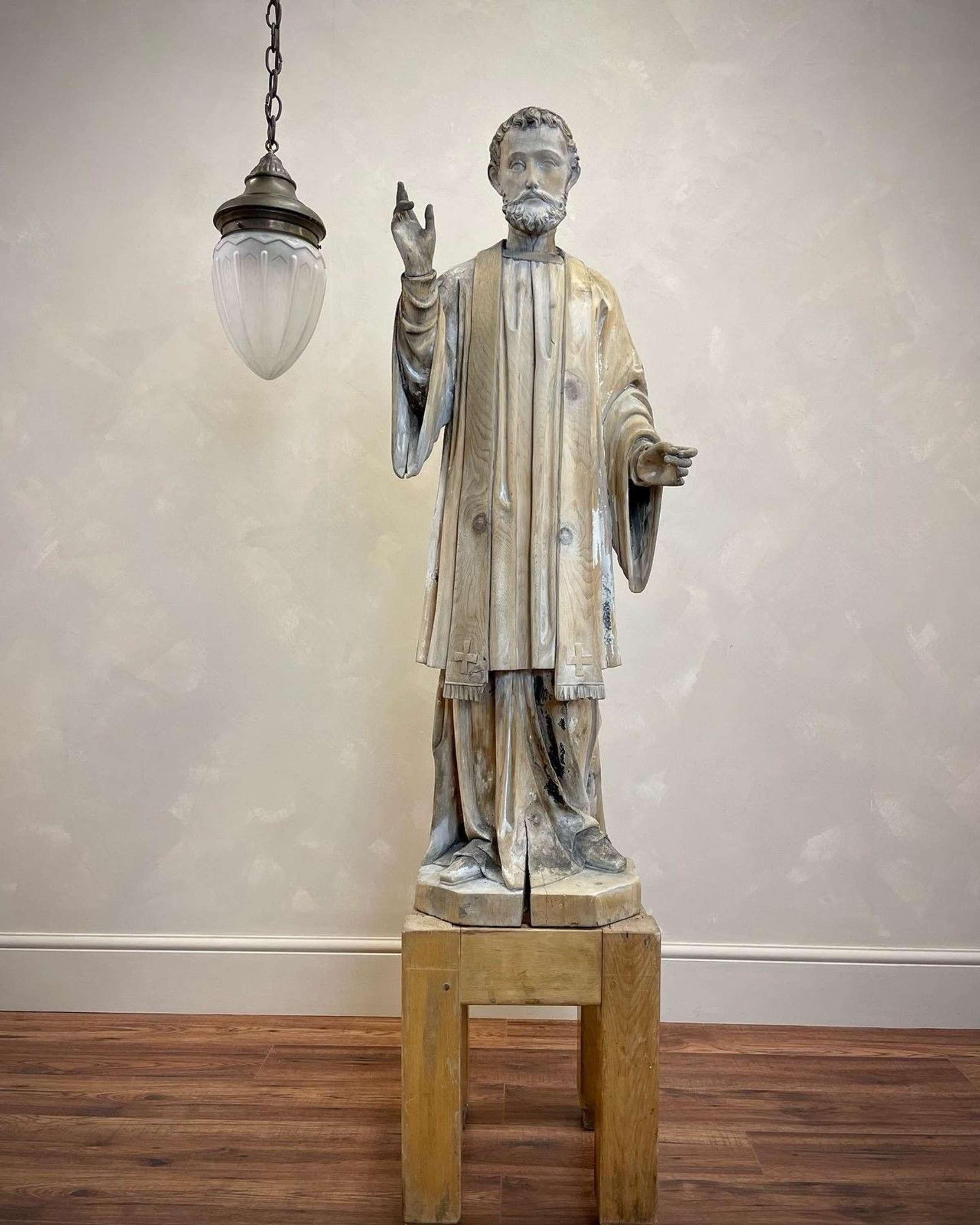 18th century, 4ft, hand carved, Roman Catholic religious figure, likely St Francis Xavier.
Dressed in his clergy wear, including stole.
With intricate carving to his hair and beard and lots of fluidity to his draping gown this would have taken