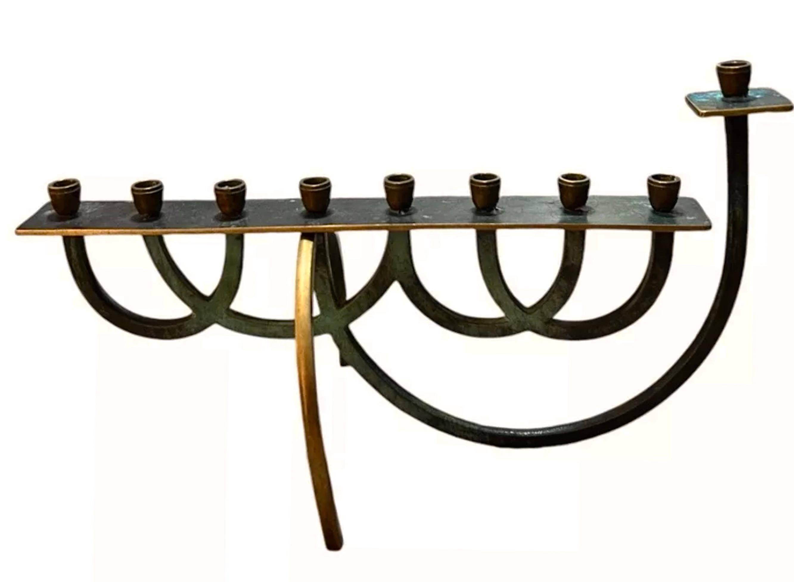 Rare Minimalist, Elegant, Mid Century Modernist Verdigris Brass Menorah. 

Made in Israel circa 1950 

Exceptionally Beautiful lines and sophisticated design. 

Very rare handmade design 