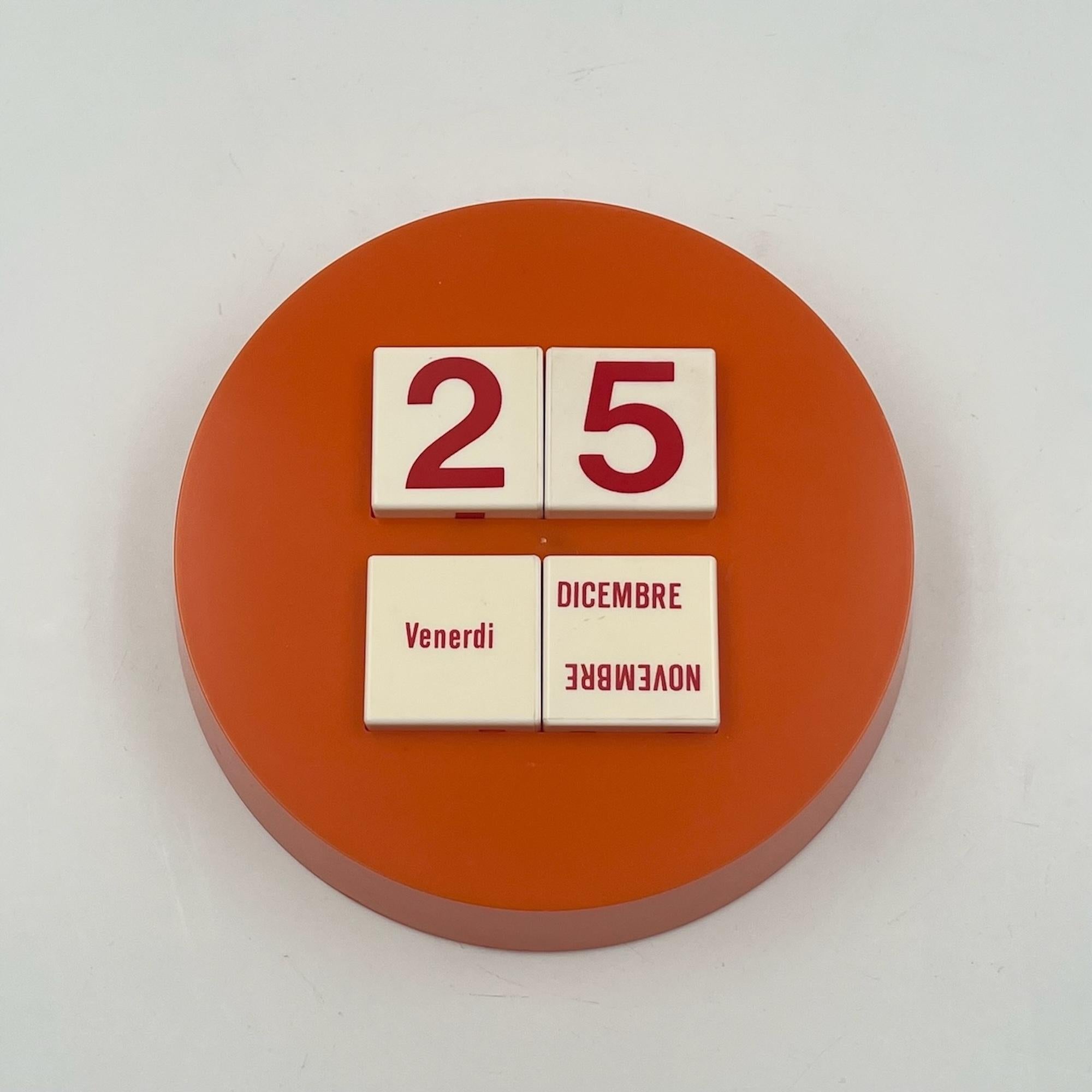 Uncover a rare gem from the 1970s with this exquisite Space Age calendar, a stunning piece of Italian design. Crafted from durable orange plastic, this vintage calendar is a true representation of the innovative and futuristic aesthetic of the Space