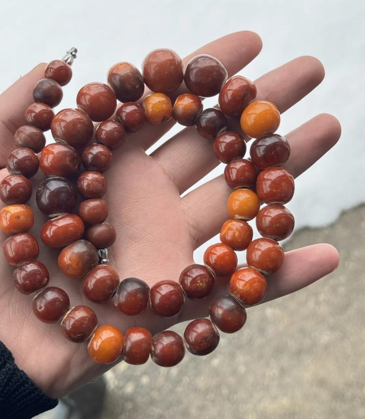 This beautiful necklace is a one-of-a-kind piece made from 72 grams of rare and fine butterscotch amber. This necklace is perfect for anyone who loves unique and eye-catching jewelry.. Don't let this rare piece pass you by! Total weight is 72 grams.