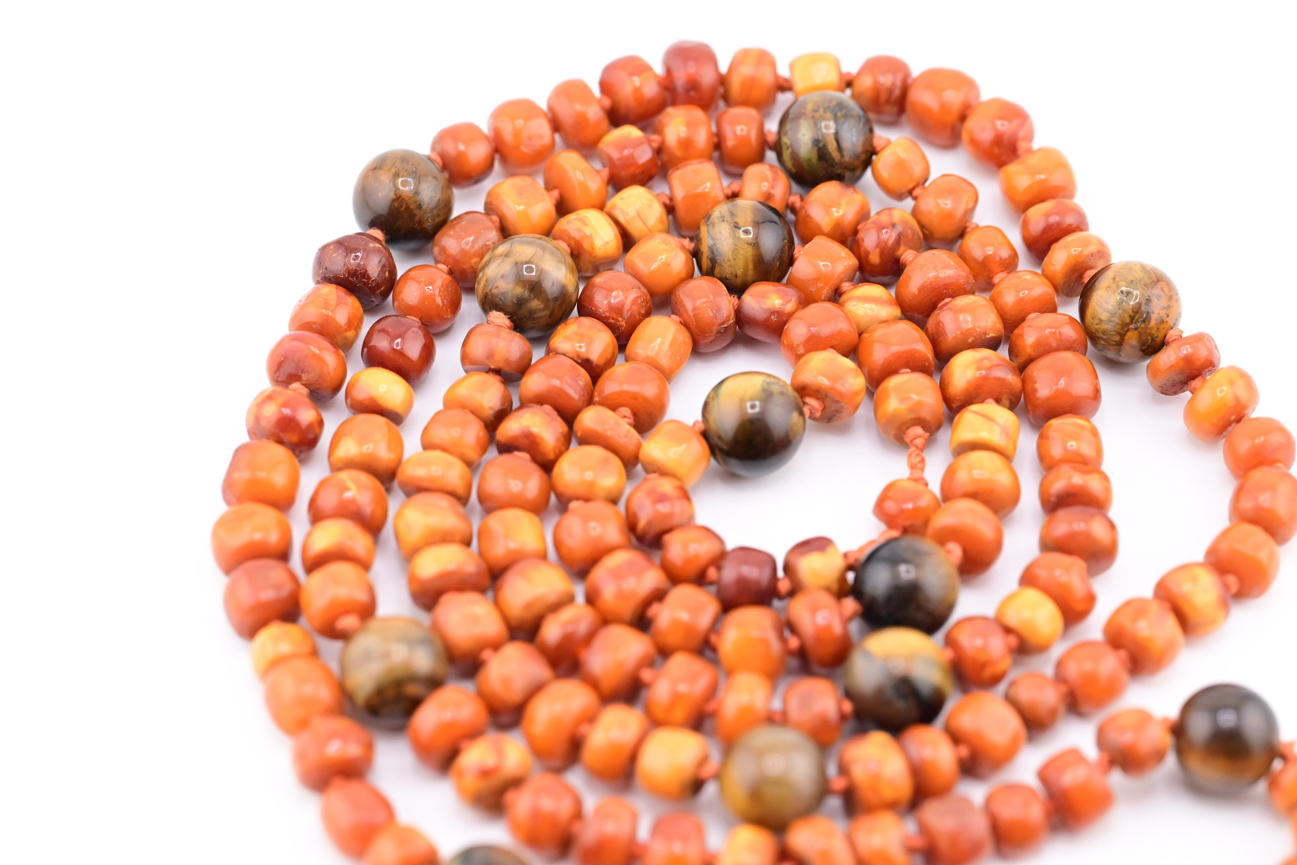 
This exquisite piece of jewelry features 76.1 grams of stunning butterscotch amber beads, meticulously strung together to create a striking necklace or set of prayer beads. The warm, earthy tones of the amber are sure to complement any wardrobe,