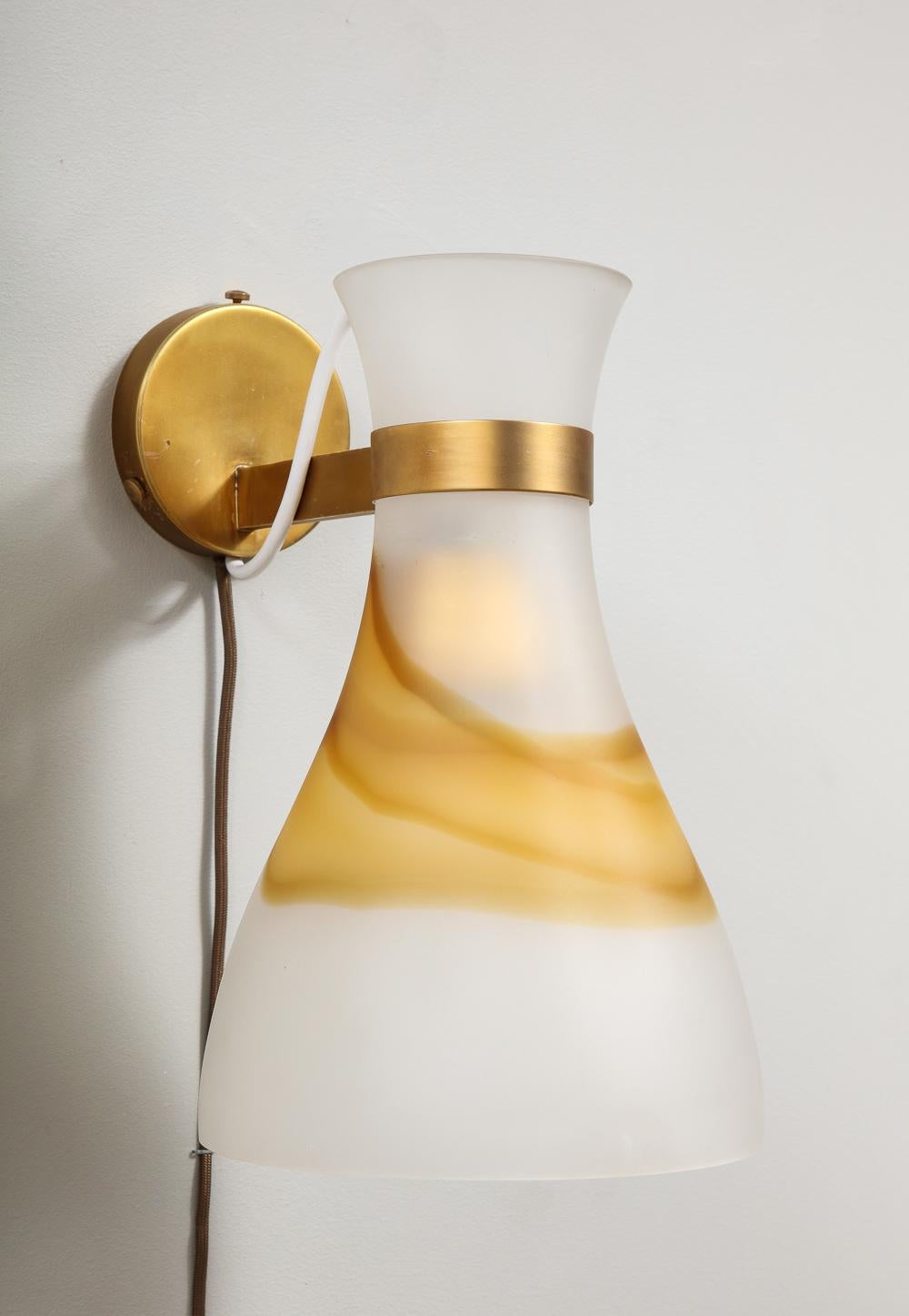 Hand blown glass, brass. Each fixture takes 1 E26 bulb. These lights can be re-oriented to point up as well. A third matching light is available. Price shown is for the pair.