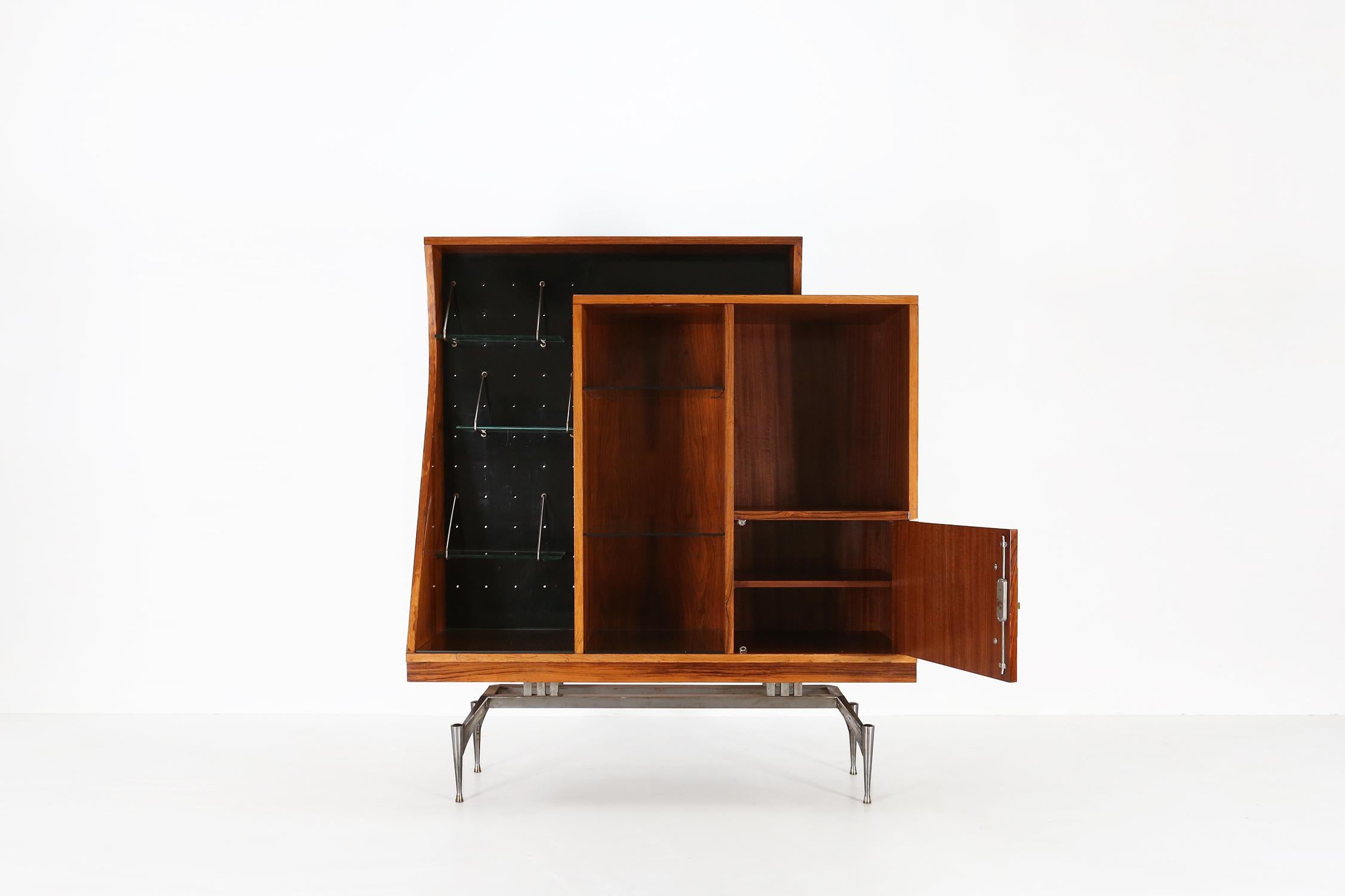 Italy / 1960 / cabinet / rosewood, glass, cast iron / Mid-century / Vintage / Italian modern
 
Very rare A-geometrically cabinet or highboard in rosewood with glass shelves. Designed in the 1960s in Italy.

This special cabinet has a cast iron