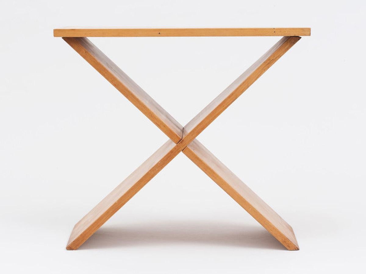 From the estate of architect A. Lawrence Kocher, this extremely rare maple wood side table was built by Kocher while teaching woodworking at Black Mountain College. Two intersecting boards establish a stable base upon which Kocher has placed a third