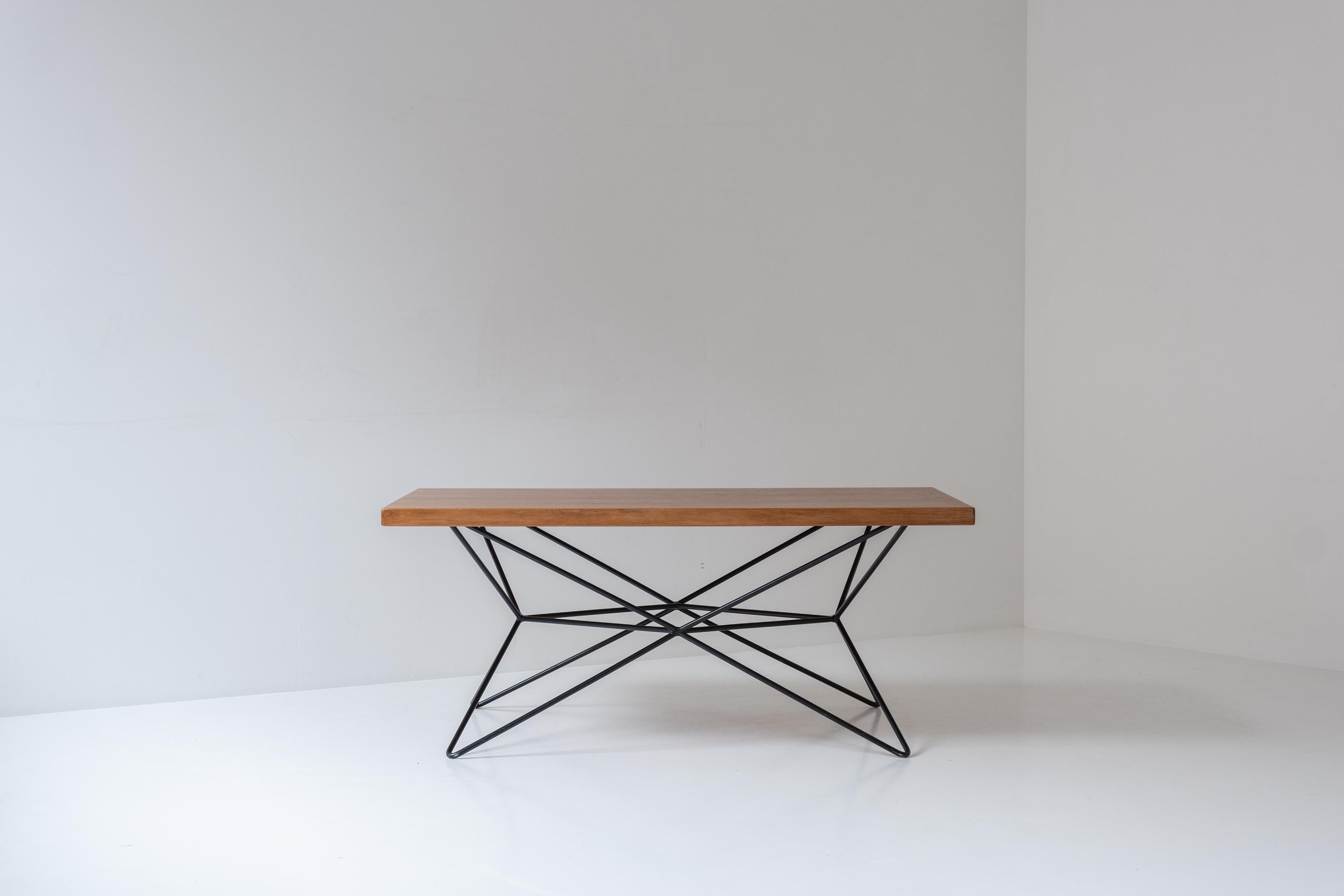 Rare multi table by Bengt Johan Gullberg, designed and manufactured in Sweden during the 1950s. This table features a black lacquered steel frame and teak wooden top. By placing the base in various positions, you can use the table either as a coffee
