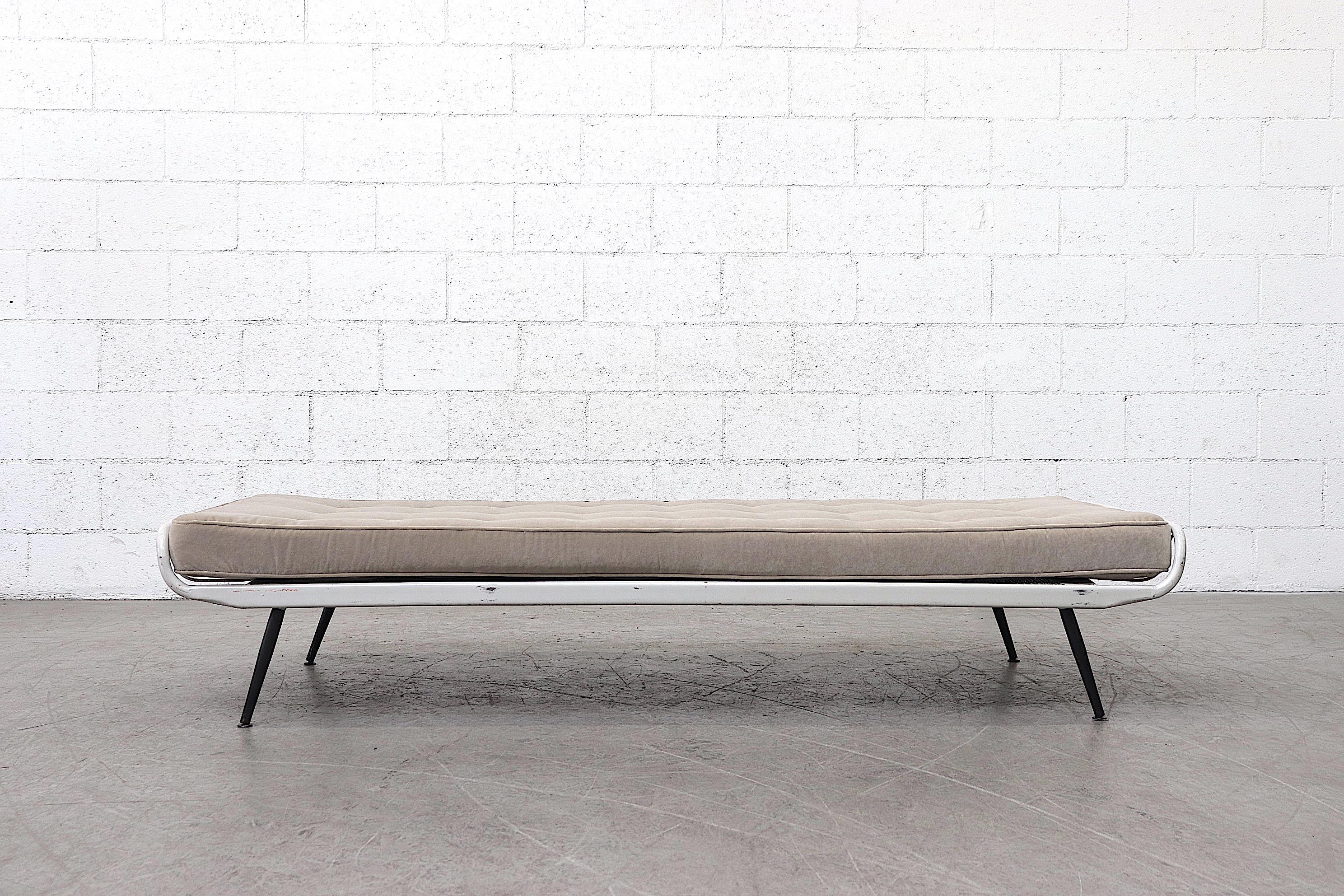 Surprisingly feminine institutional grey enameled metal daybed frame by Rawi Winschoten, 1950s. New dove grey velvet mattress. Frame in original condition with wear consistent with its age and usage.