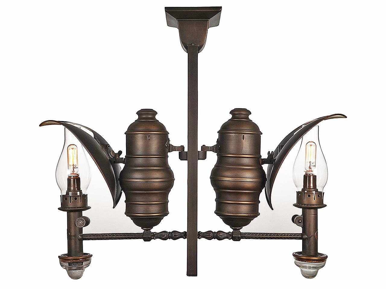 The lamp is signed Adams And Westlake Railroad Chandelier. We found turn of the century catalogue rendering/listings of this type of lamp. The Adlake book calls it a postal-lamp. It's rare when you have the chance to purchase objects from an
