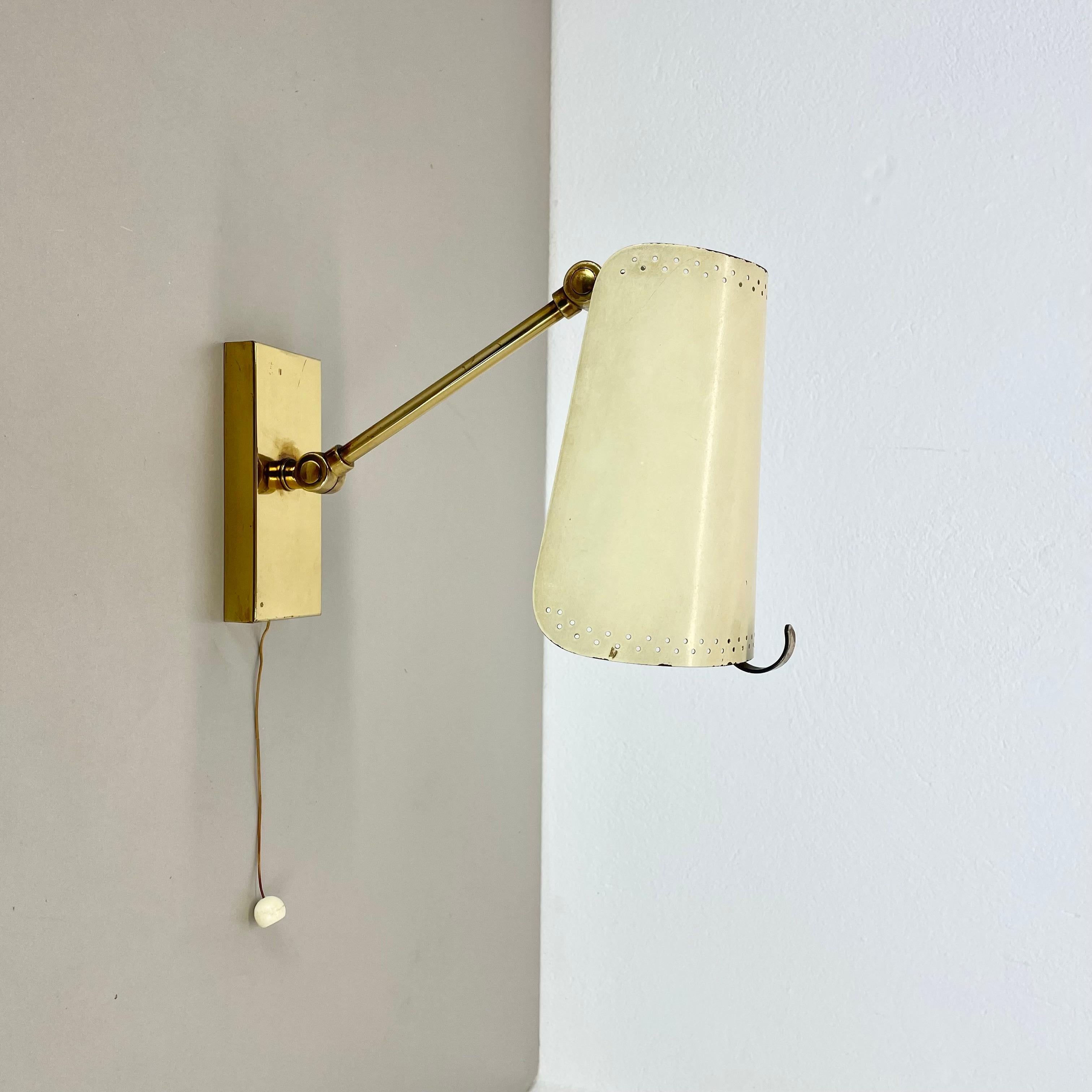 Article:

brass theatre wall light



Origin:

Italy



Age:

1950s


This modernist light was produced in Italy in the 1950s in Italy. It is made of brass and metal with a large shade element on the front. it features a very unique hole pattern