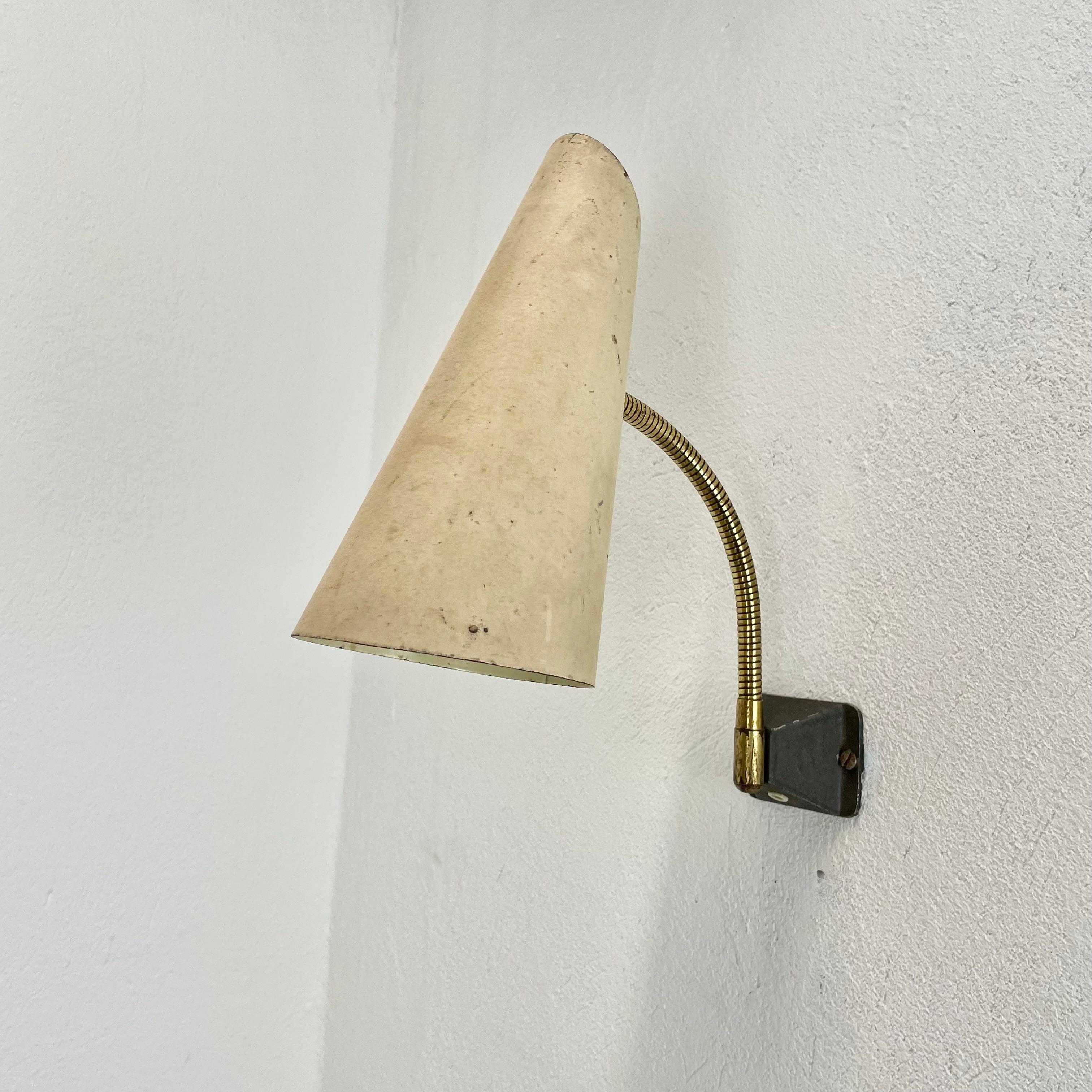 Article:

wall light with diabolo shade



Origin:

Italy



Age:

1950s


This modernist light was produced in Italy in the 1950s in Italy. It is made of brass and metal with a large shade element on the front. it features a very unique diabolo