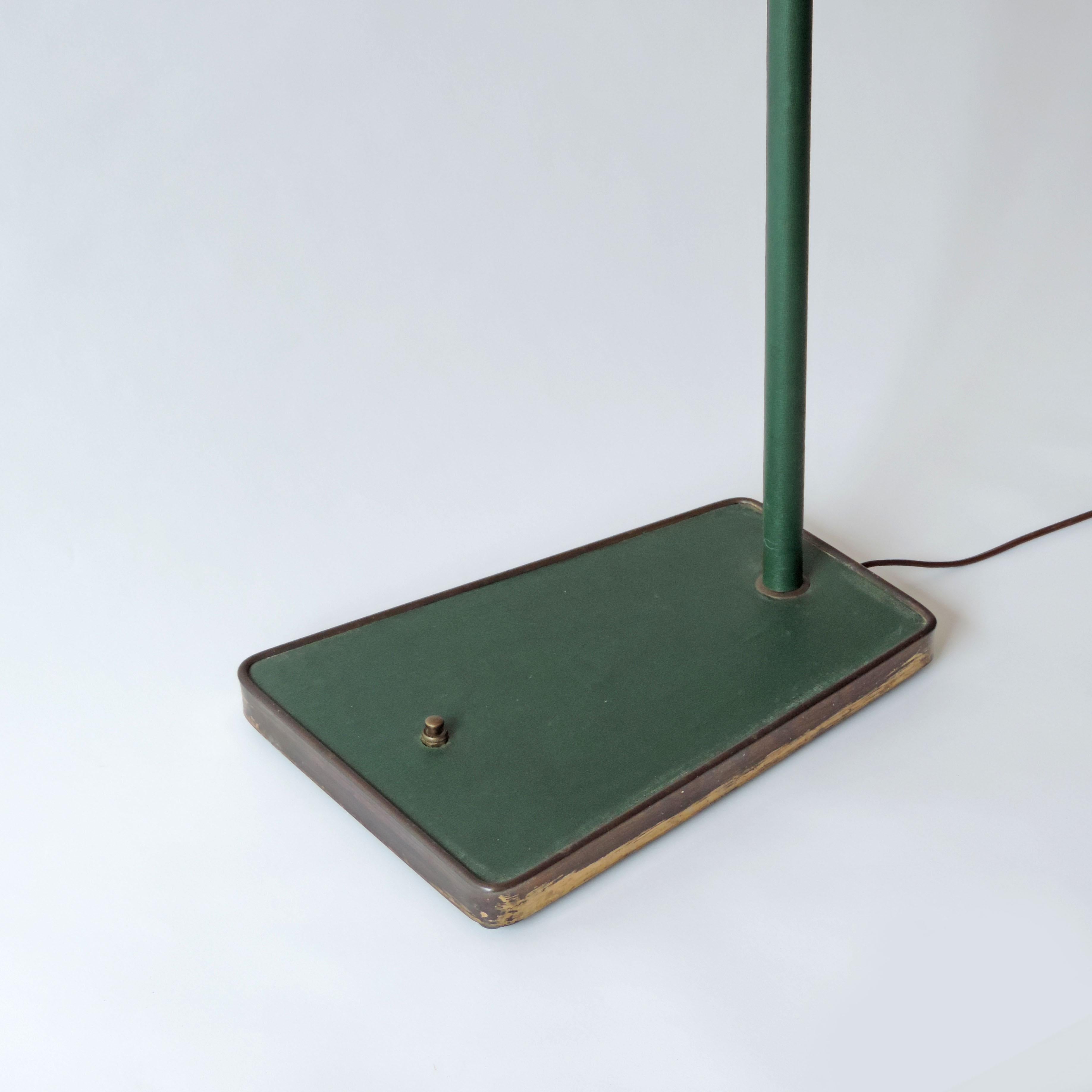 Unknown designer adjustable Italian floor lamp in brass and green faux leather, 1940s
Size varies depending on positioning.