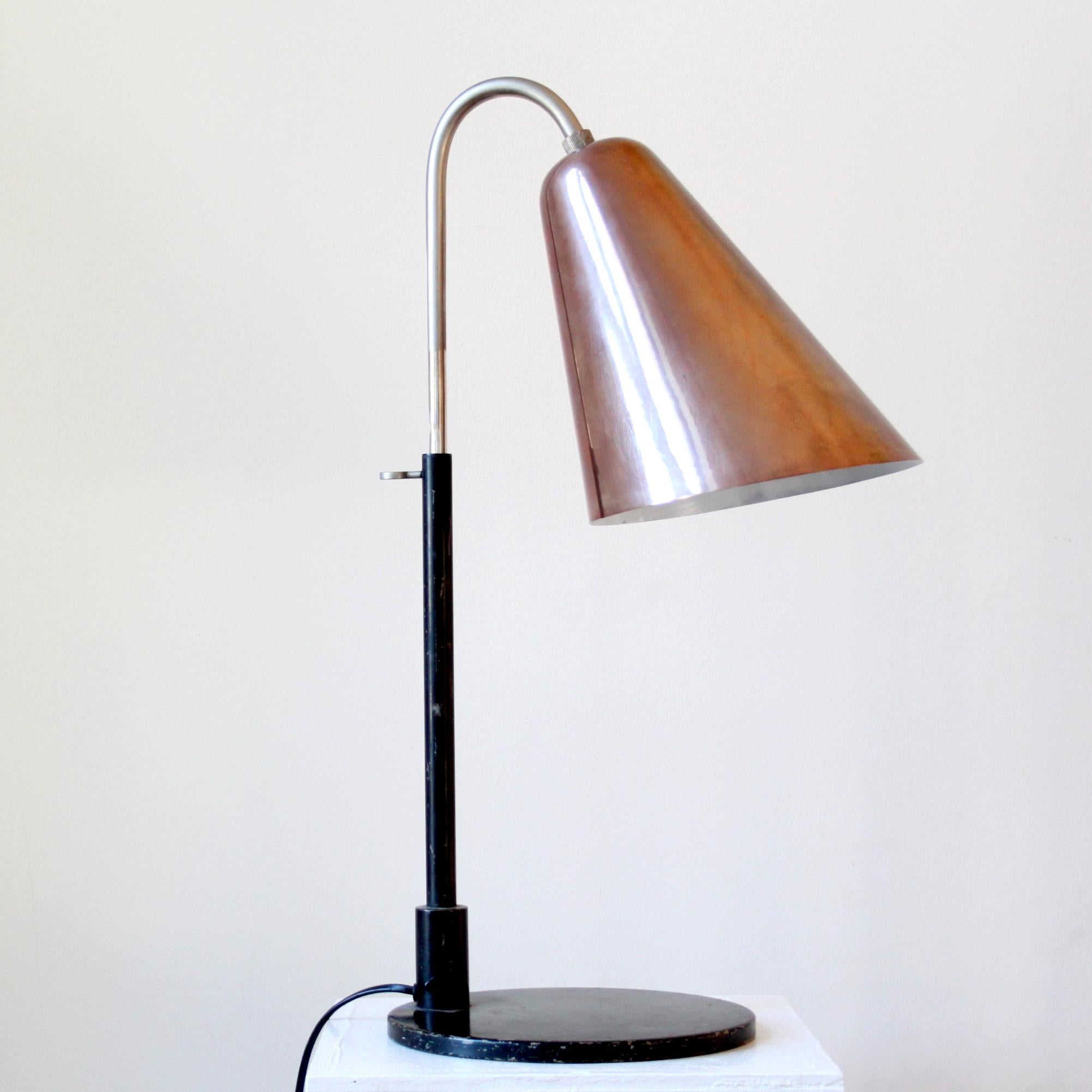 FRITS SCHLEGEL & VILHELM LAURITZEN

SCANDINAVIAN MODERN

Rare, large adjustable table lamp with cone-shaped brass shade by Frits Schlegel and Vilhelm Lauritzen. Mounted with push button switch, bakelite. Designed 1928. This example was manufactured