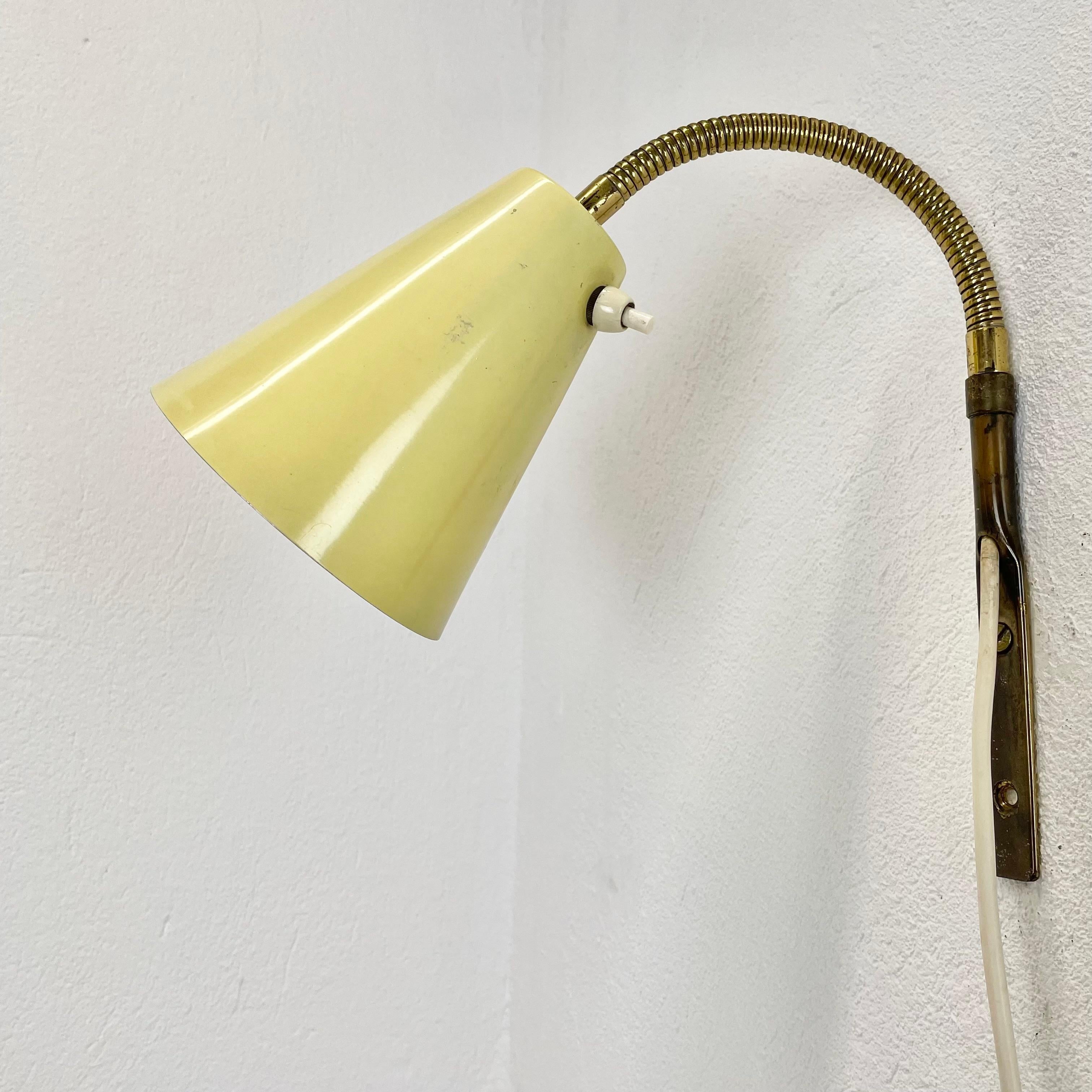 Article:

wall light with yellow shade



Origin:

Italy



Age:

1950s


This modernist light was produced in Italy in the 1950s in Italy. It is made of brass and metal with a yellow shade element on the front. it features a very unique form which