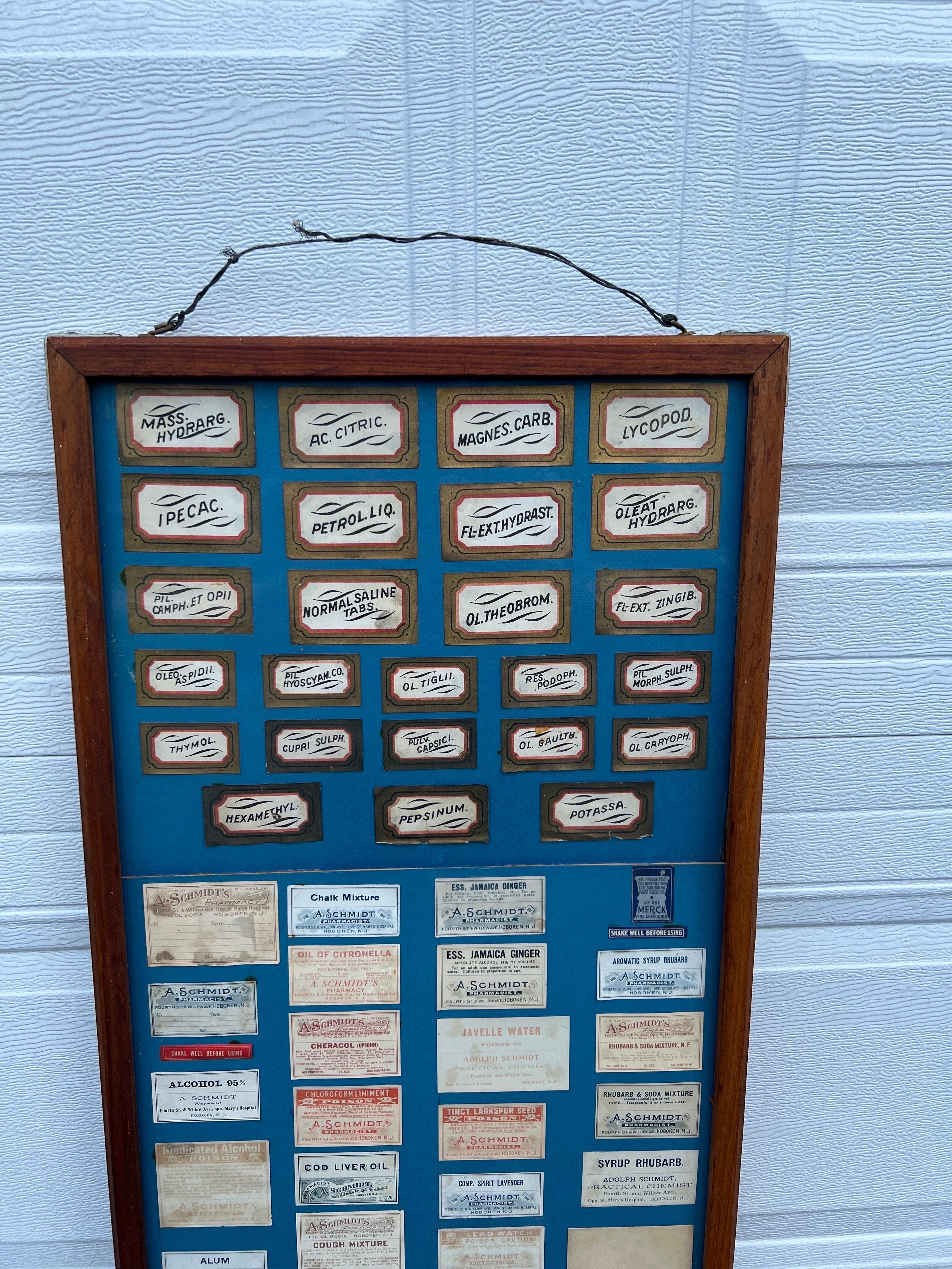 A fantastic Antique general store or pharmacy label display featuring 110 different labels from a famous 19th / 20th century pharmacy in Hoboken NJ. 
Adolph Schmidt's pharmacy was located at 267 Fourth St in Hoboken across from St. Mary's Hospital